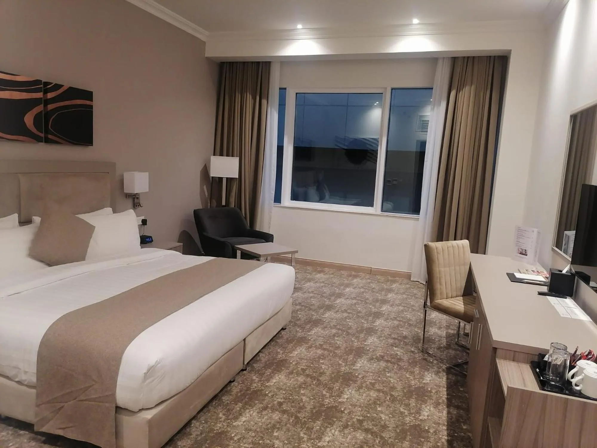 Bed in Gloria Hotel & Suites Doha