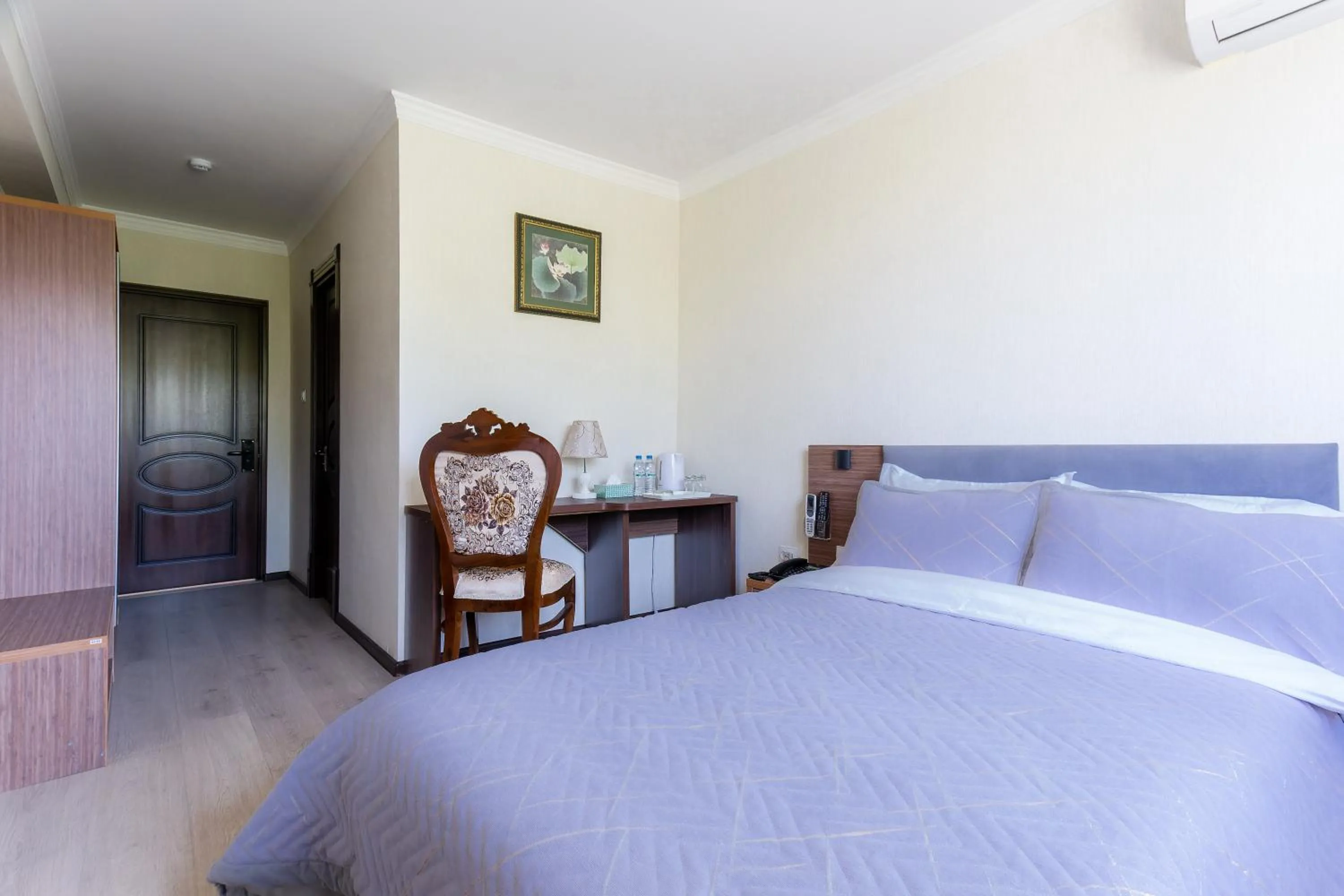 Bed in CENTRAL ASİA HOTEL