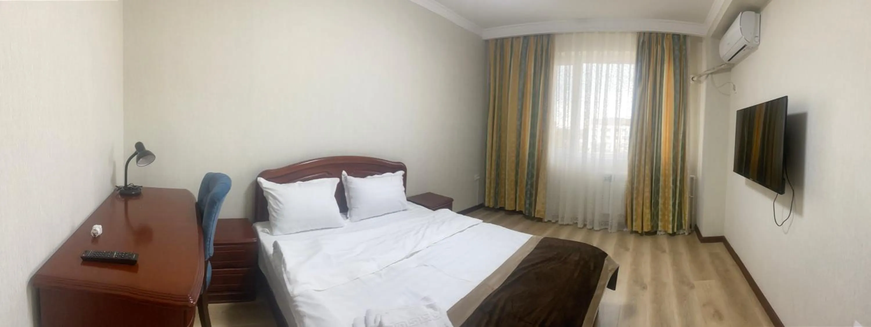 Bed in CENTRAL ASİA HOTEL