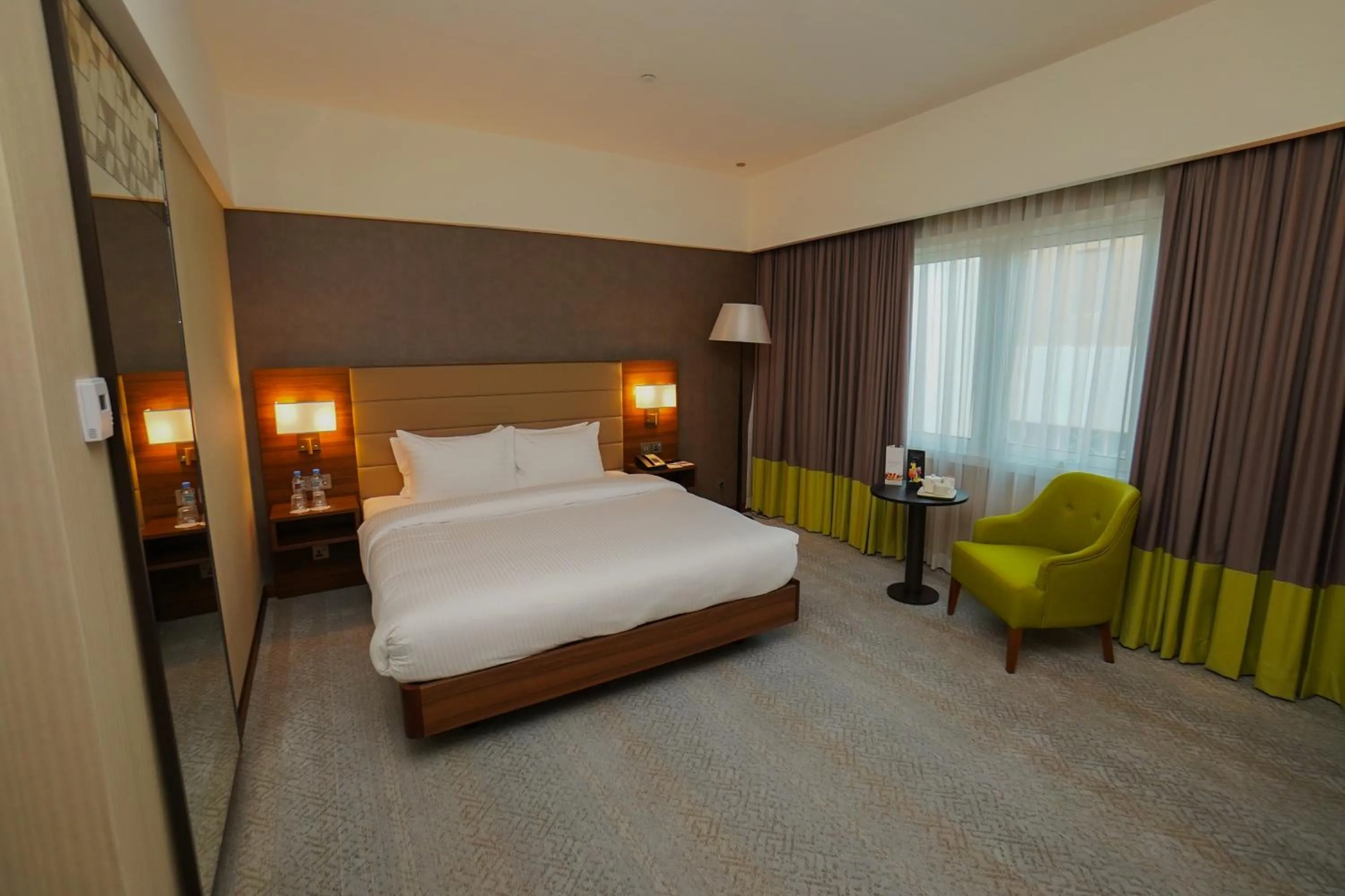 Bed in The Grand Lux Hotel