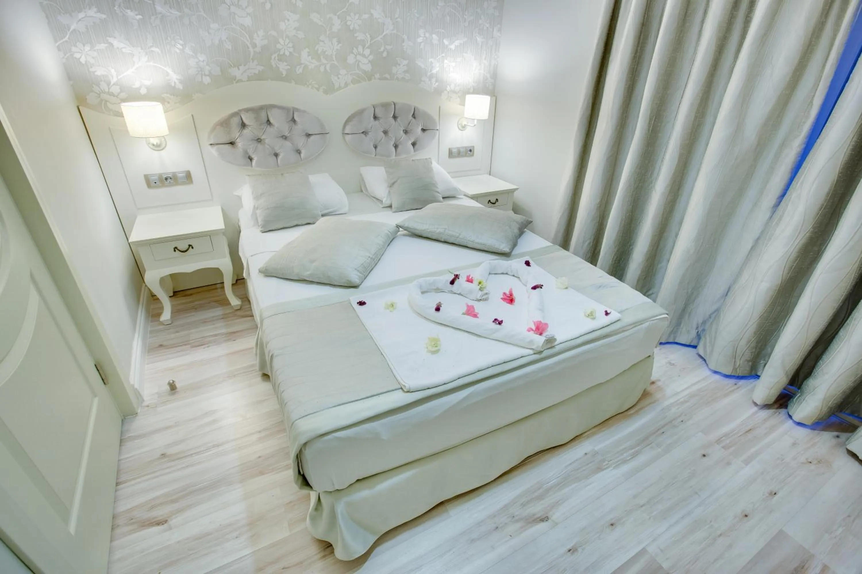 Photo of the whole room, Bed in Pinehill Hotel & Suites