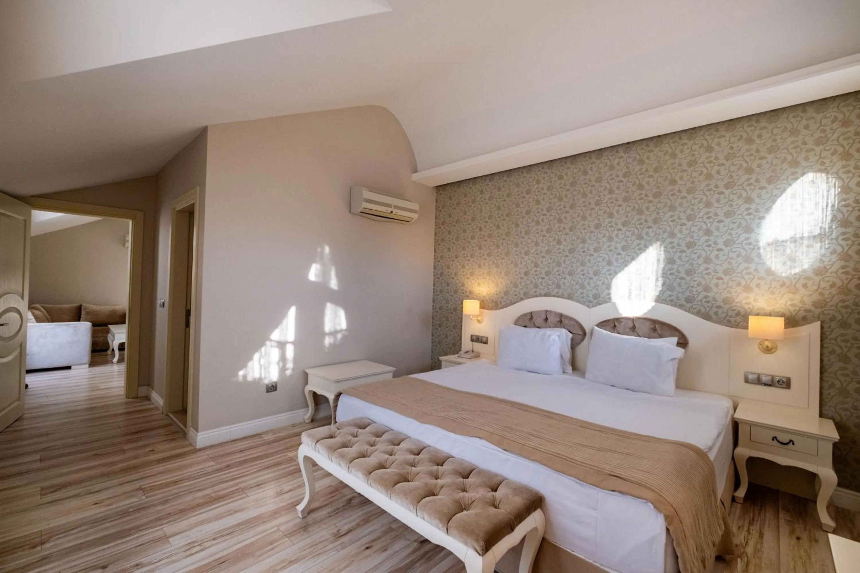 Bed in Pinehill Hotel & Suites