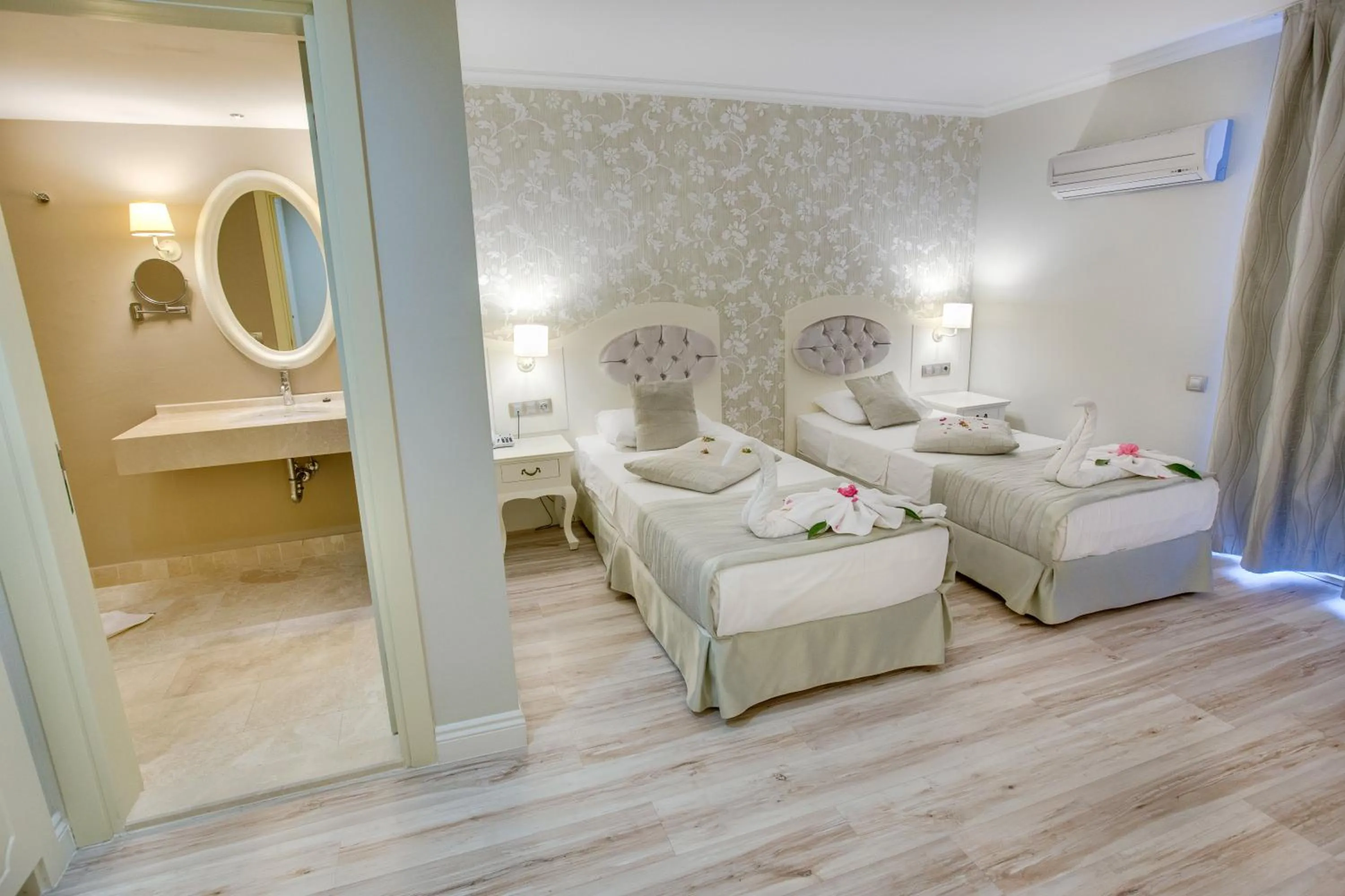 Photo of the whole room, Bed in Pinehill Hotel & Suites