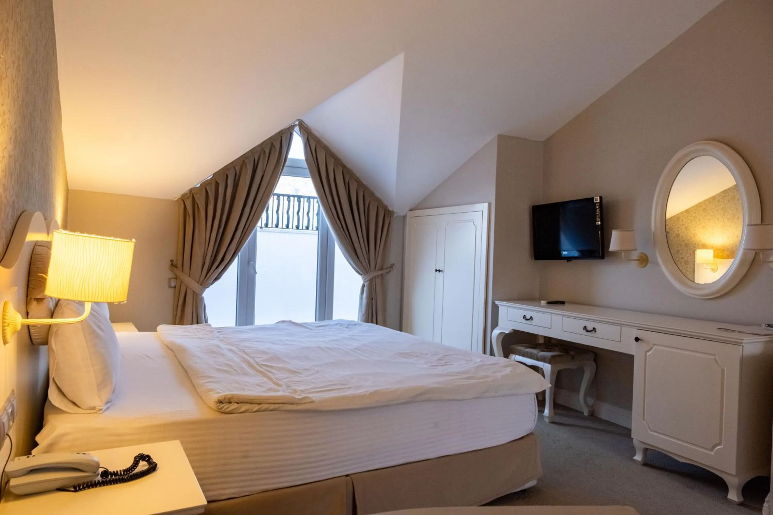 Bed in Pinehill Hotel & Suites