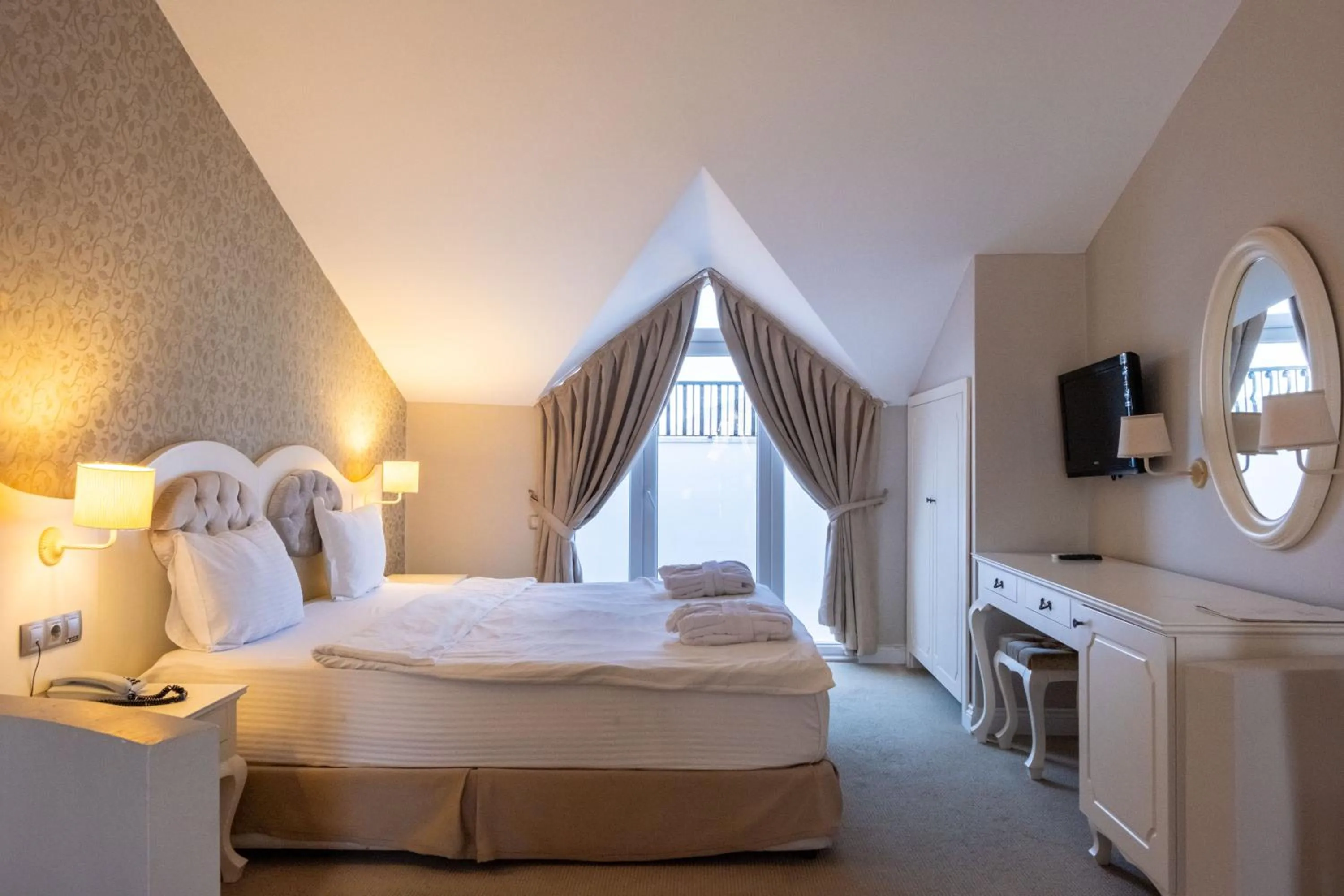 Bed in Pinehill Hotel & Suites