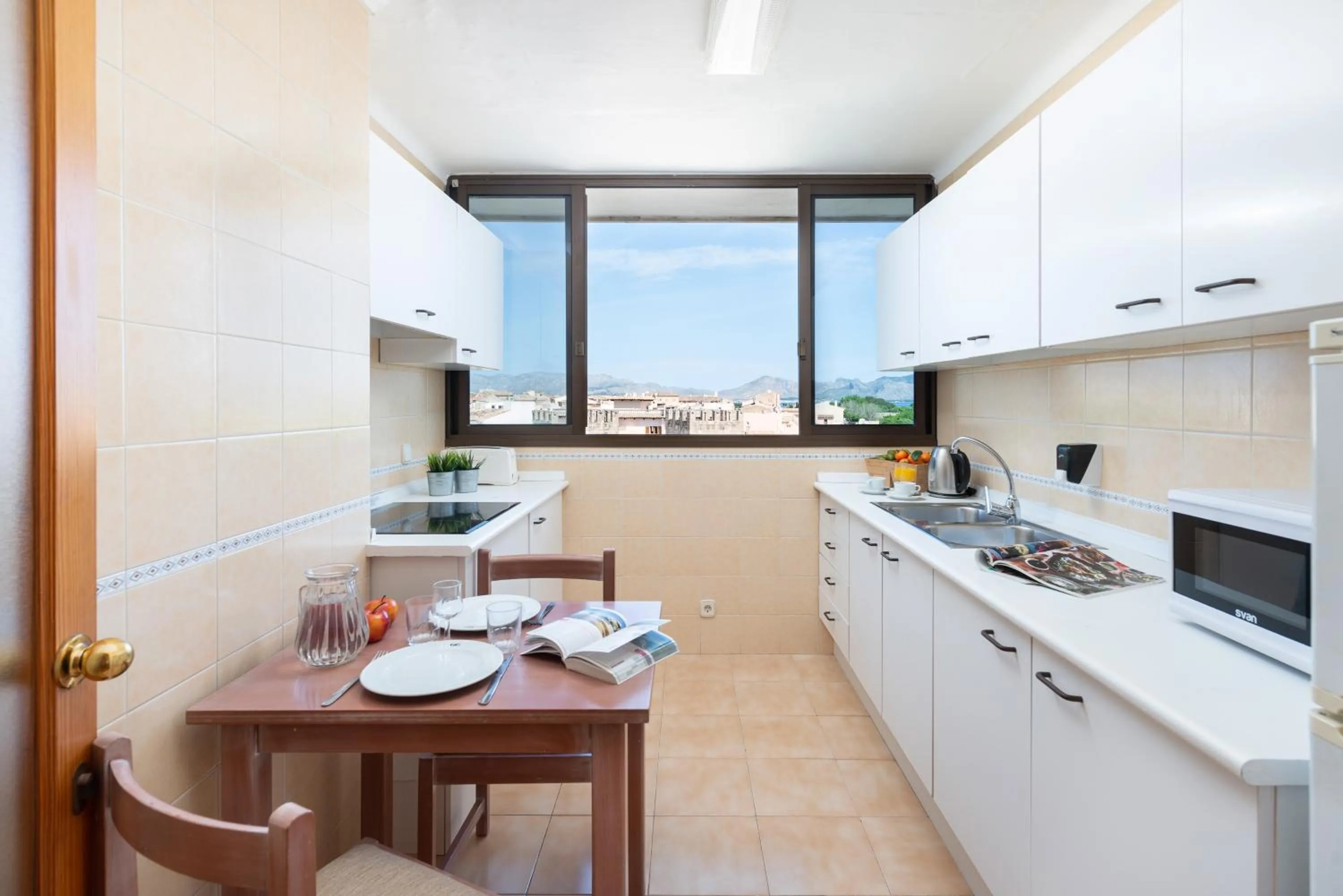 Kitchen or kitchenette in Apartamentos Carlos V