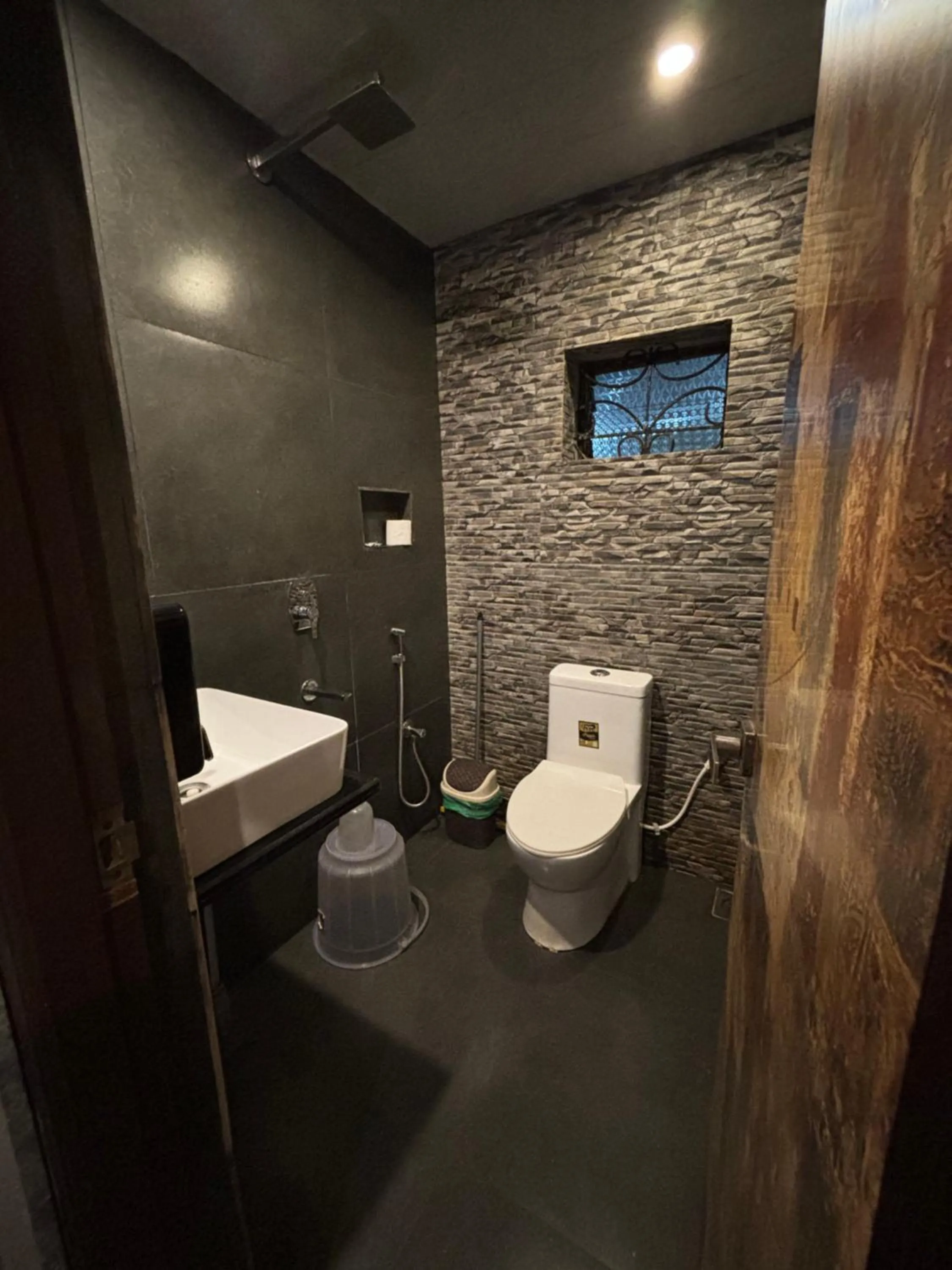 Bathroom in Aariv Inn BAGA BEACH