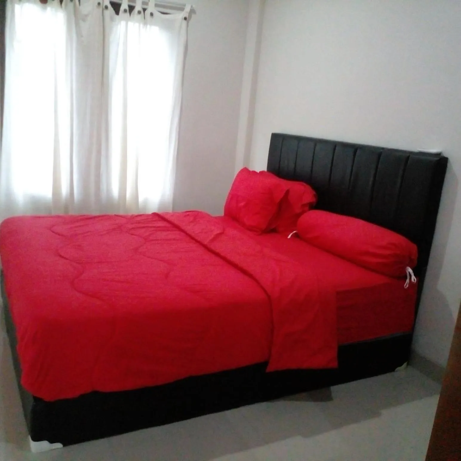 Bed in Lembunai Home Stay
