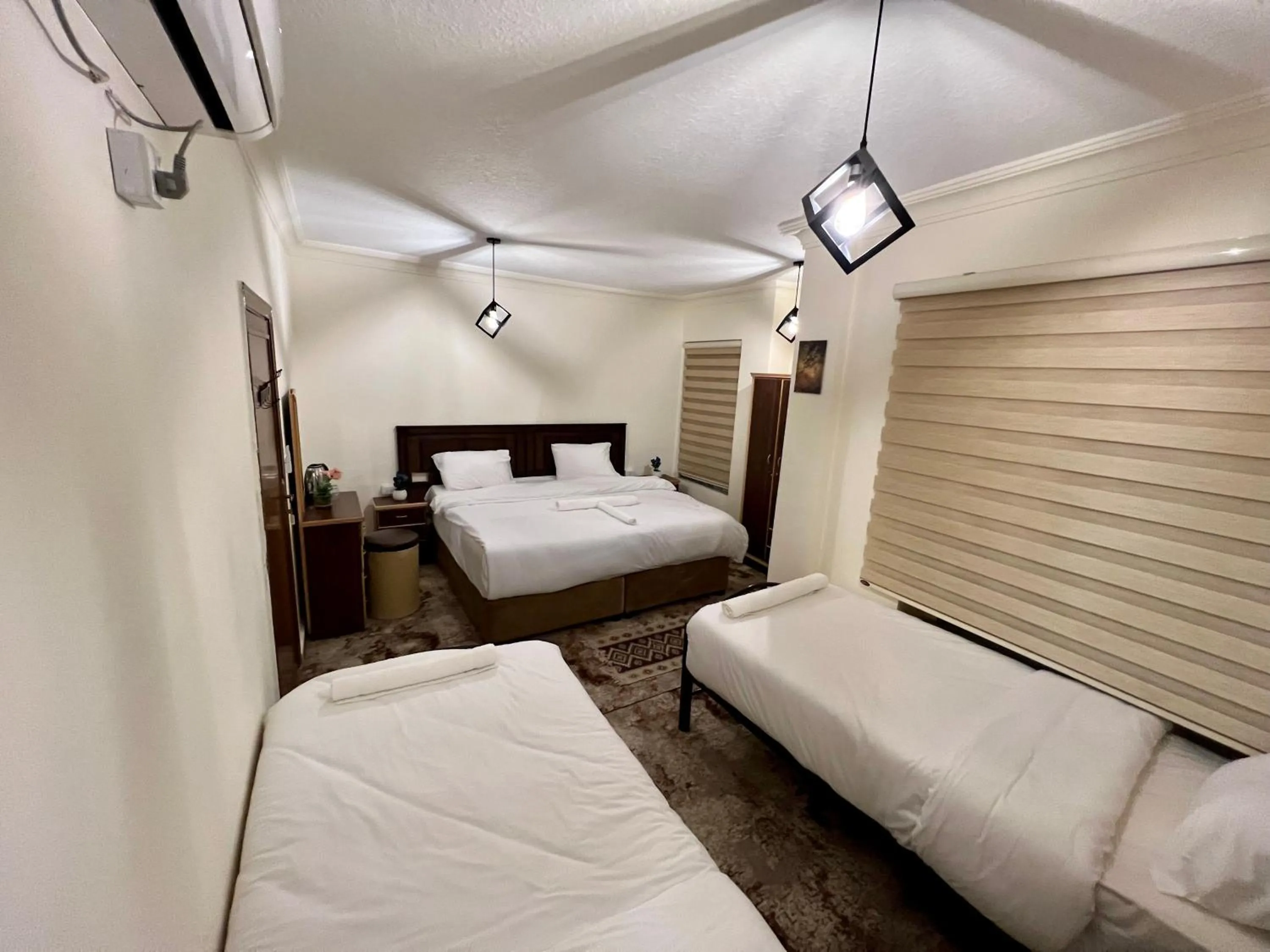 Bed in Raqeem Hotel