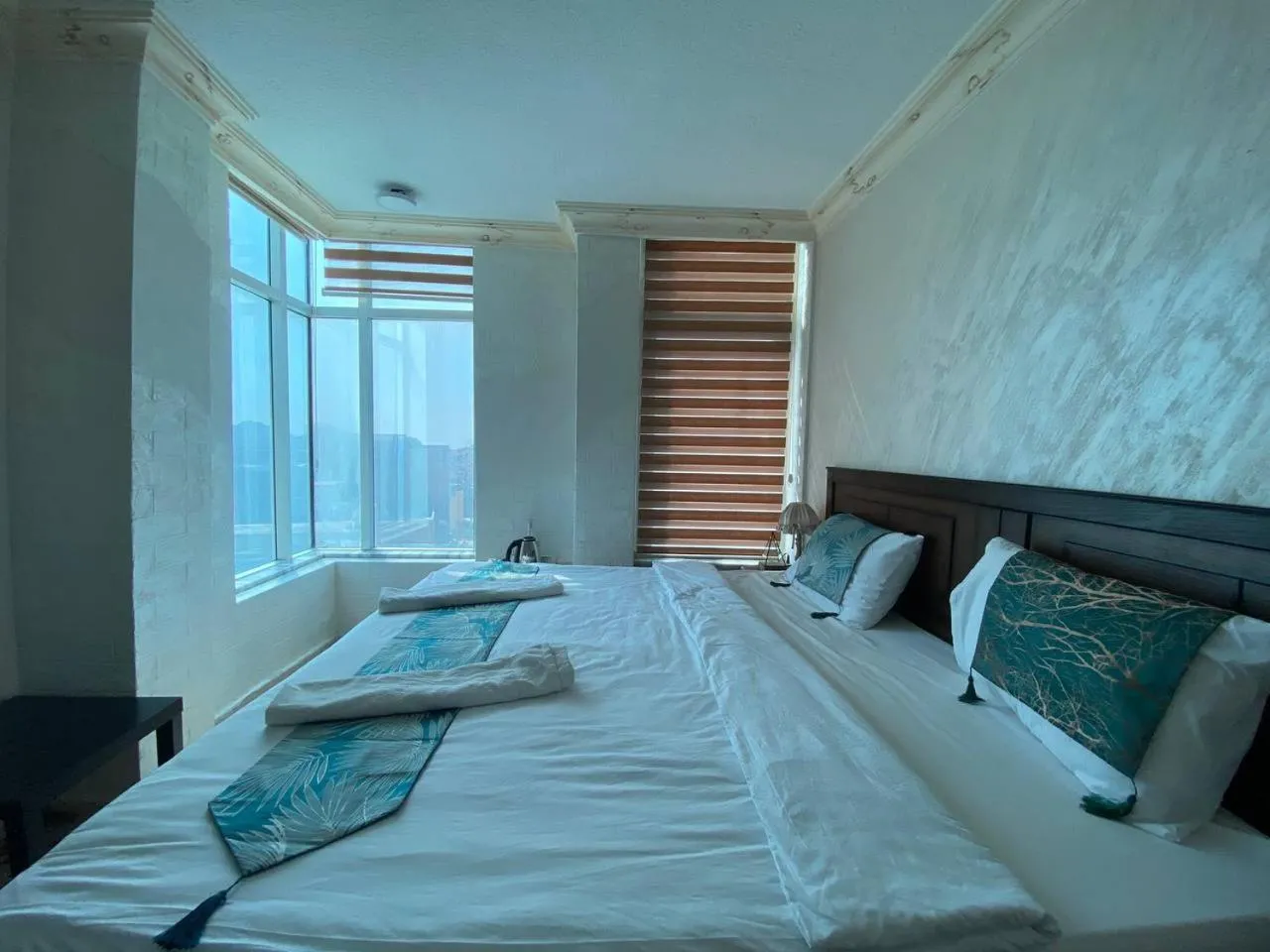 Bed in Raqeem Hotel