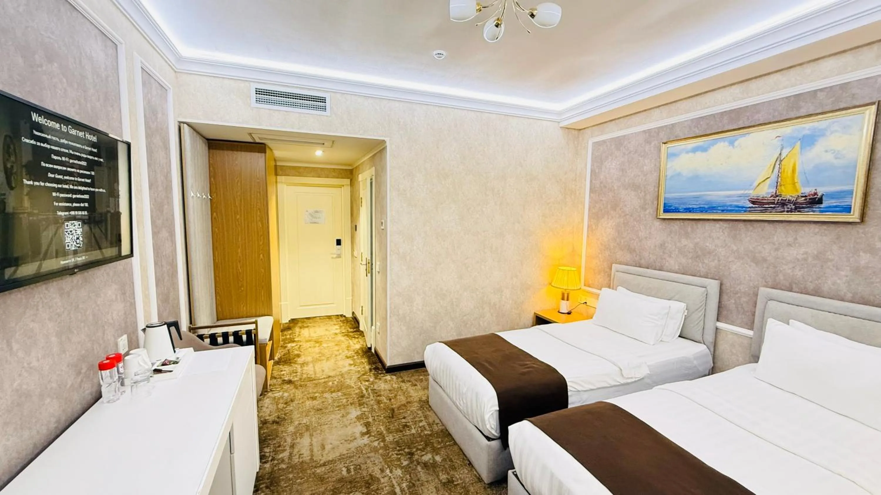 Communal lounge/ TV room, Bed in Garnet Hotel Tashkent