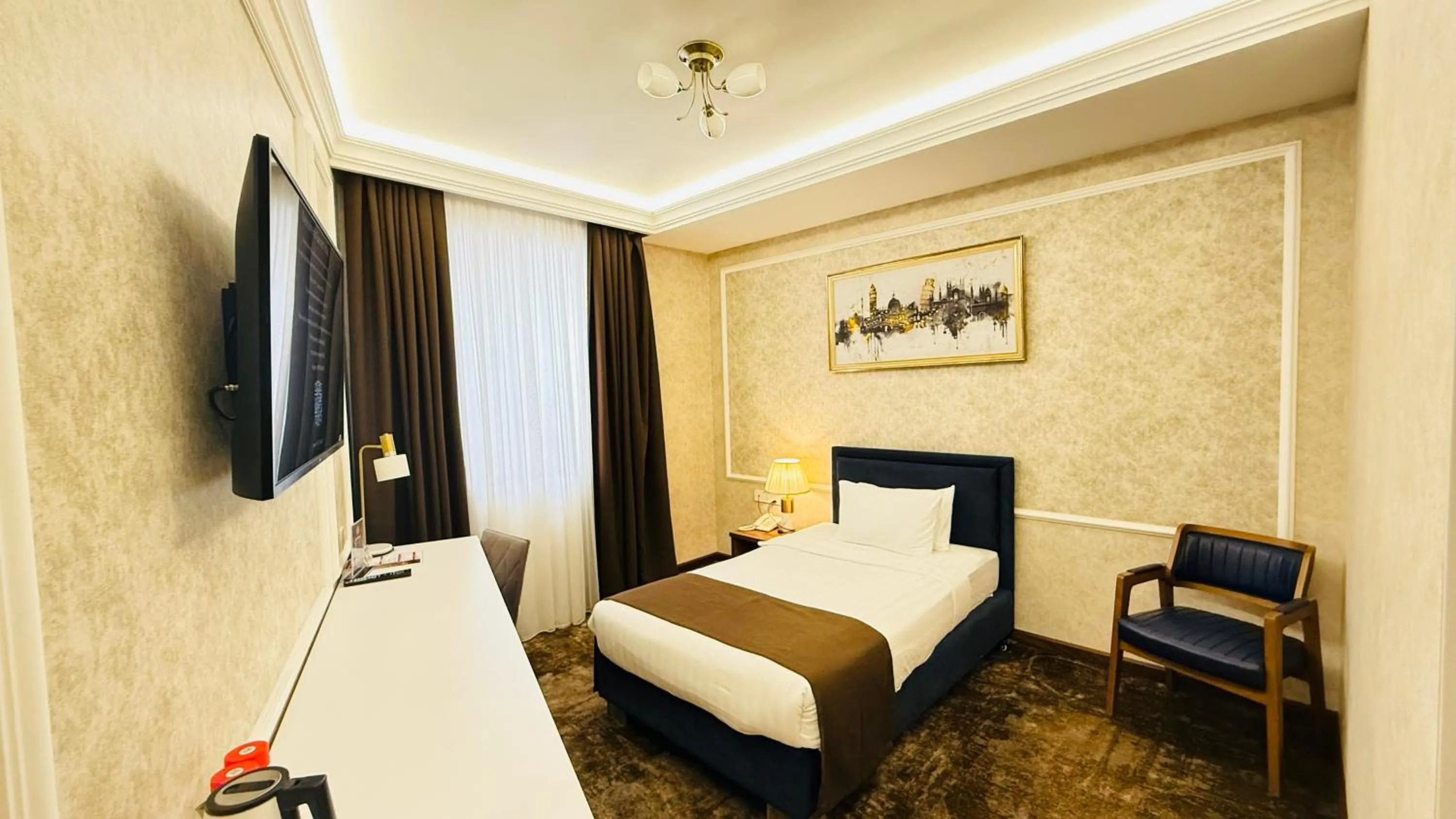 Communal lounge/ TV room, Bed in Garnet Hotel Tashkent