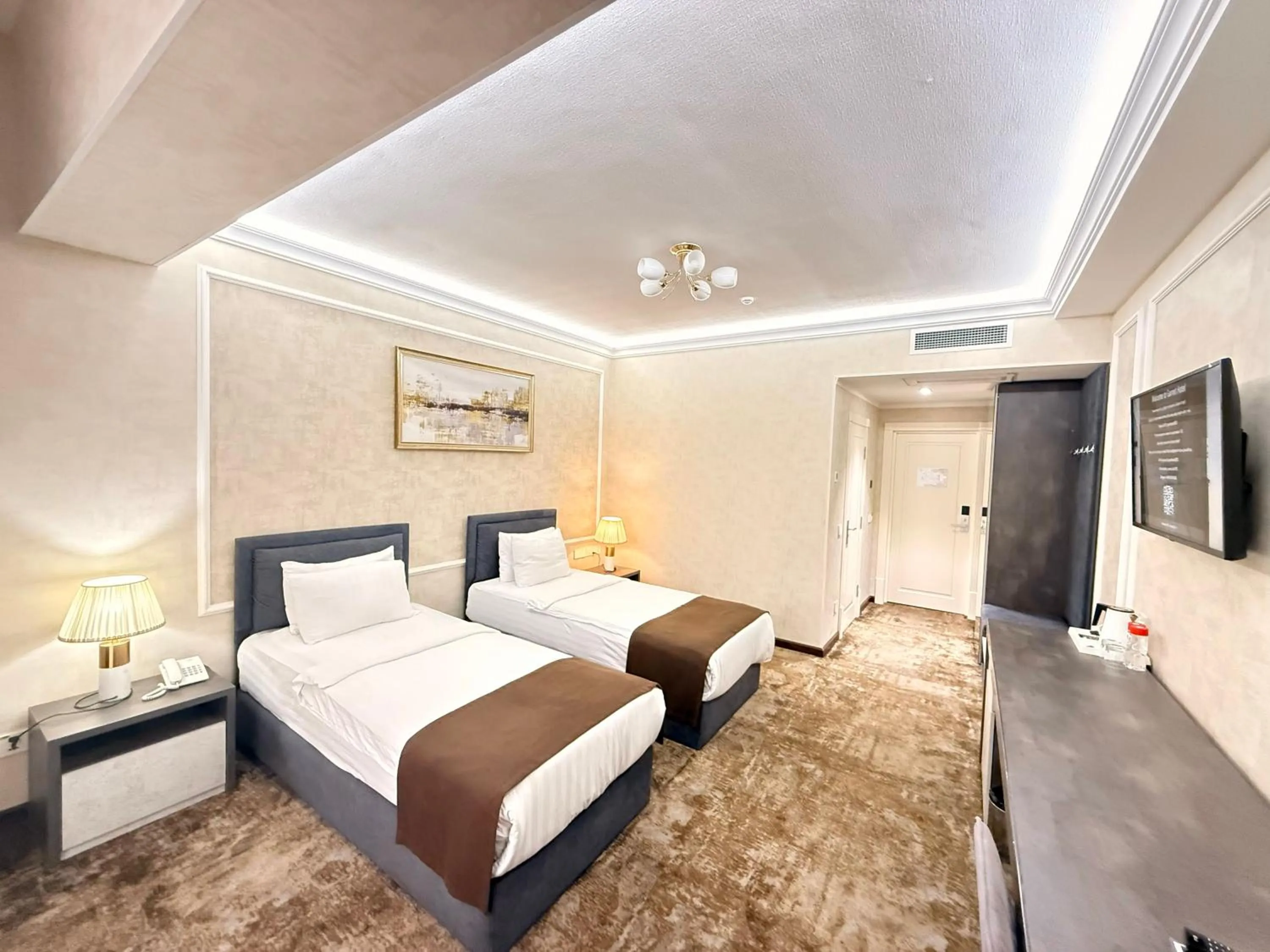 Communal lounge/ TV room, Bed in Garnet Hotel Tashkent