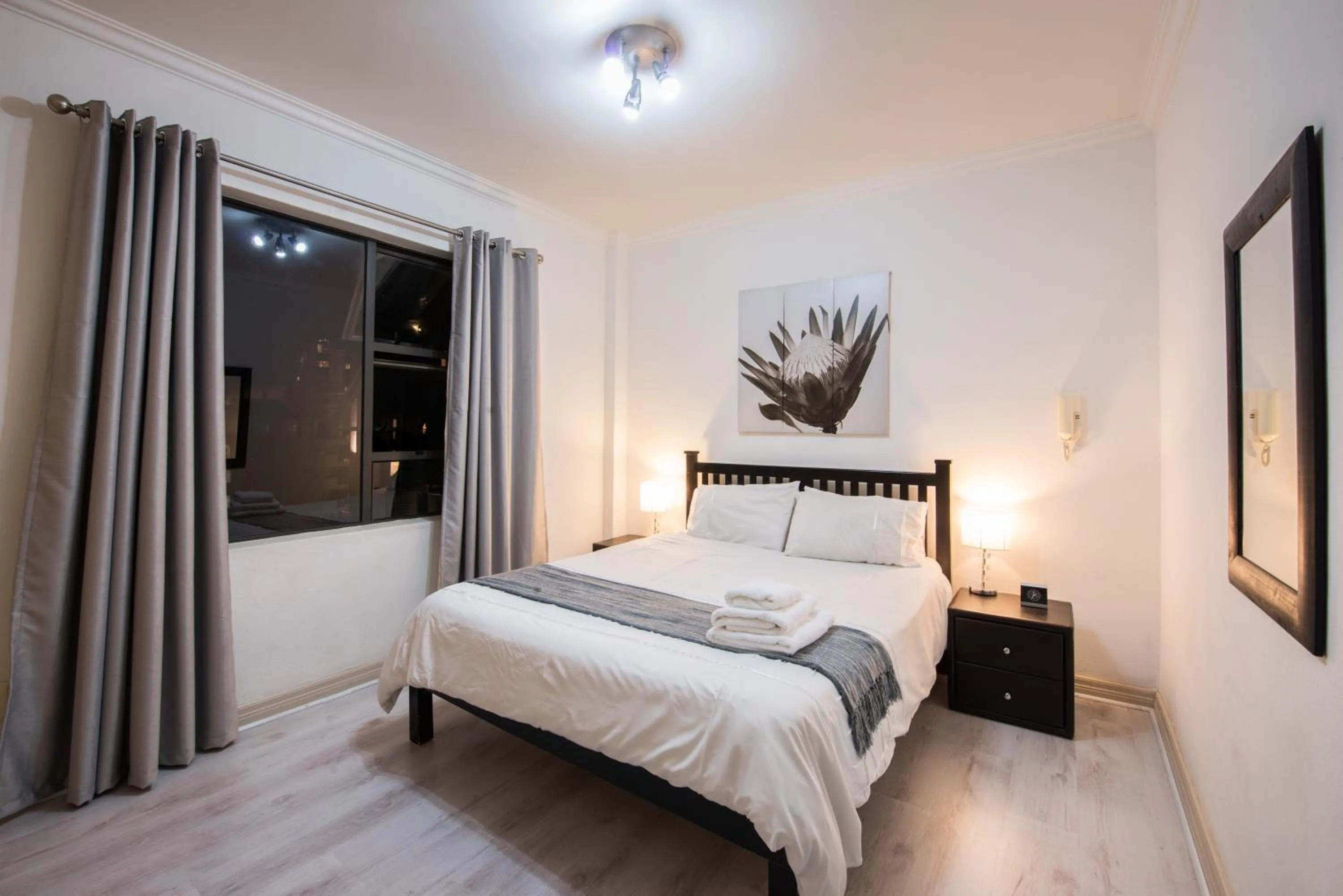 Photo of the whole room, Bed in Prestige Apartments Sandton at Westpoint