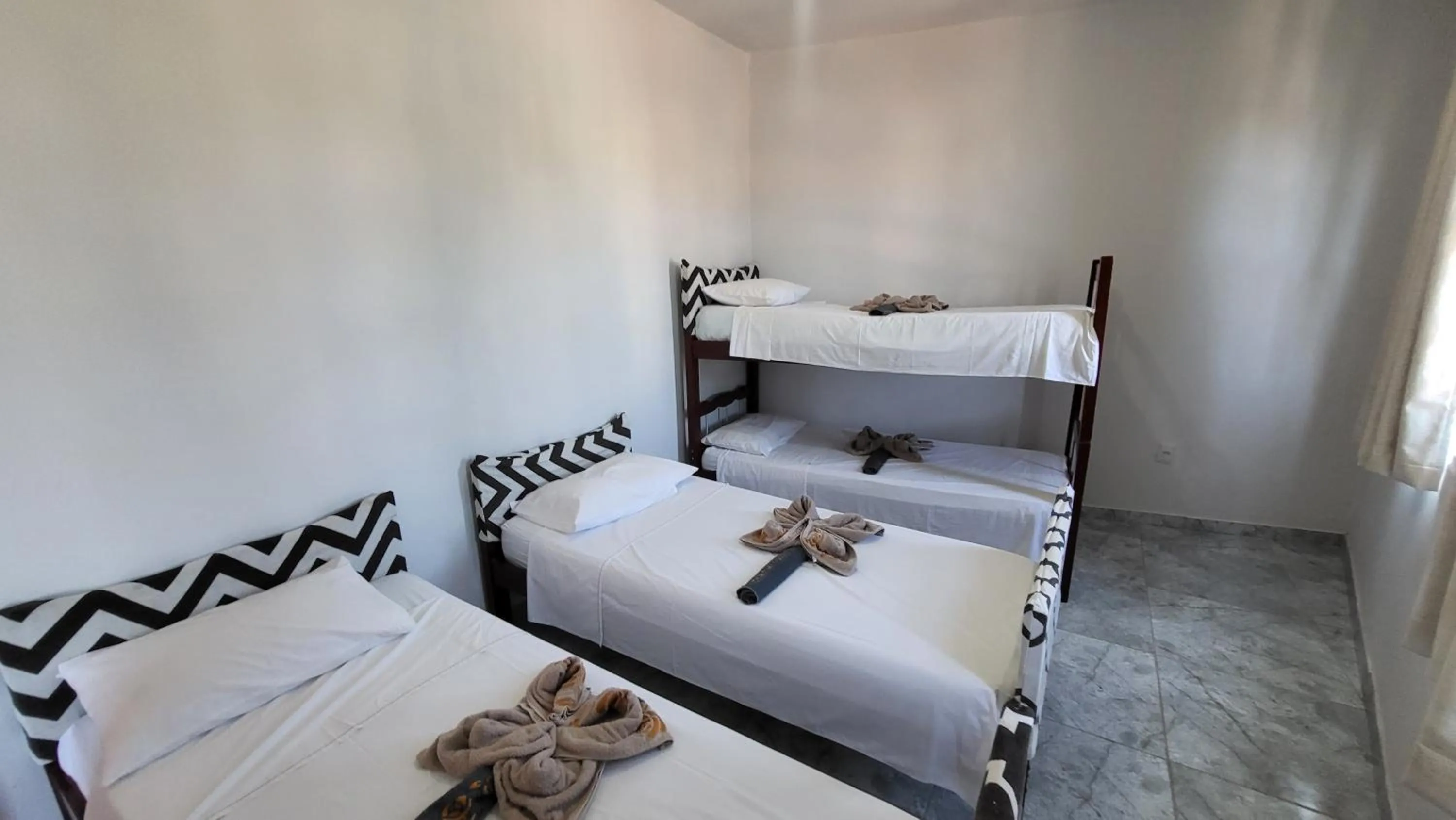 Bed in Tamboleiro's Hotel Residence