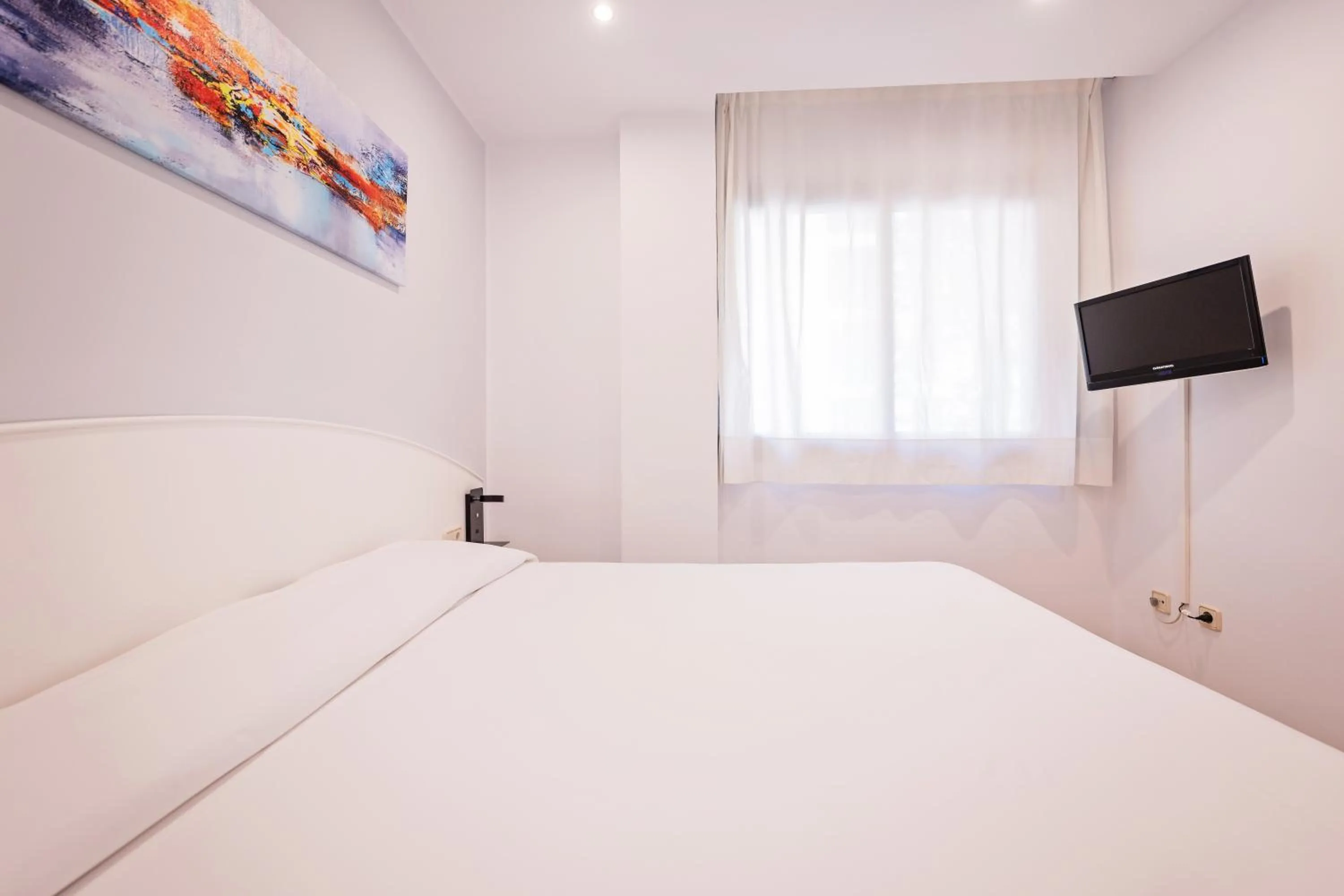 Bed in Aparthotel Napols - Abapart