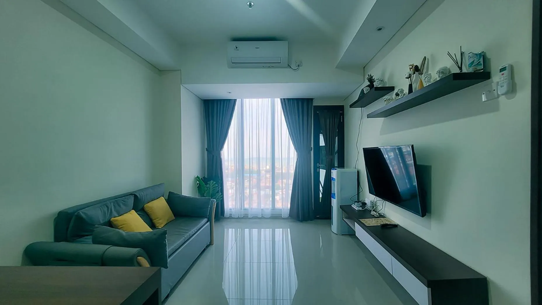 Communal lounge/ TV room in Palam Mansion at Meisterstadt Pollux Habibie Apartment