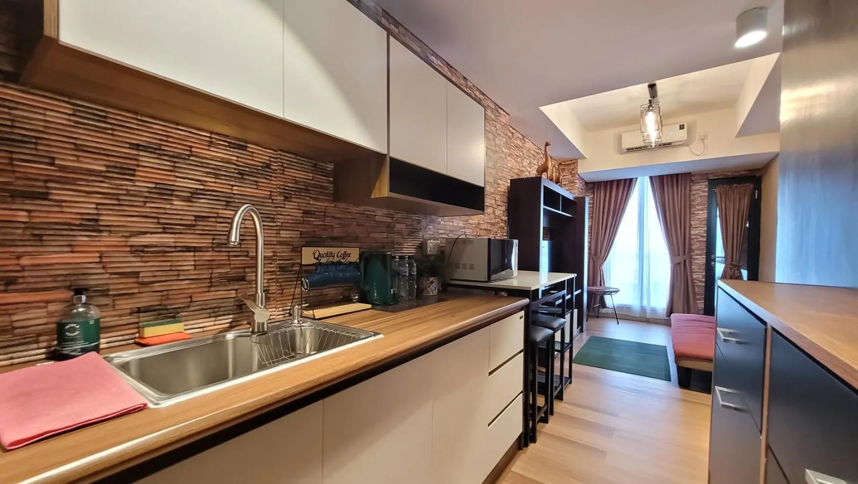 Kitchen or kitchenette in Palam Mansion at Meisterstadt Pollux Habibie Apartment