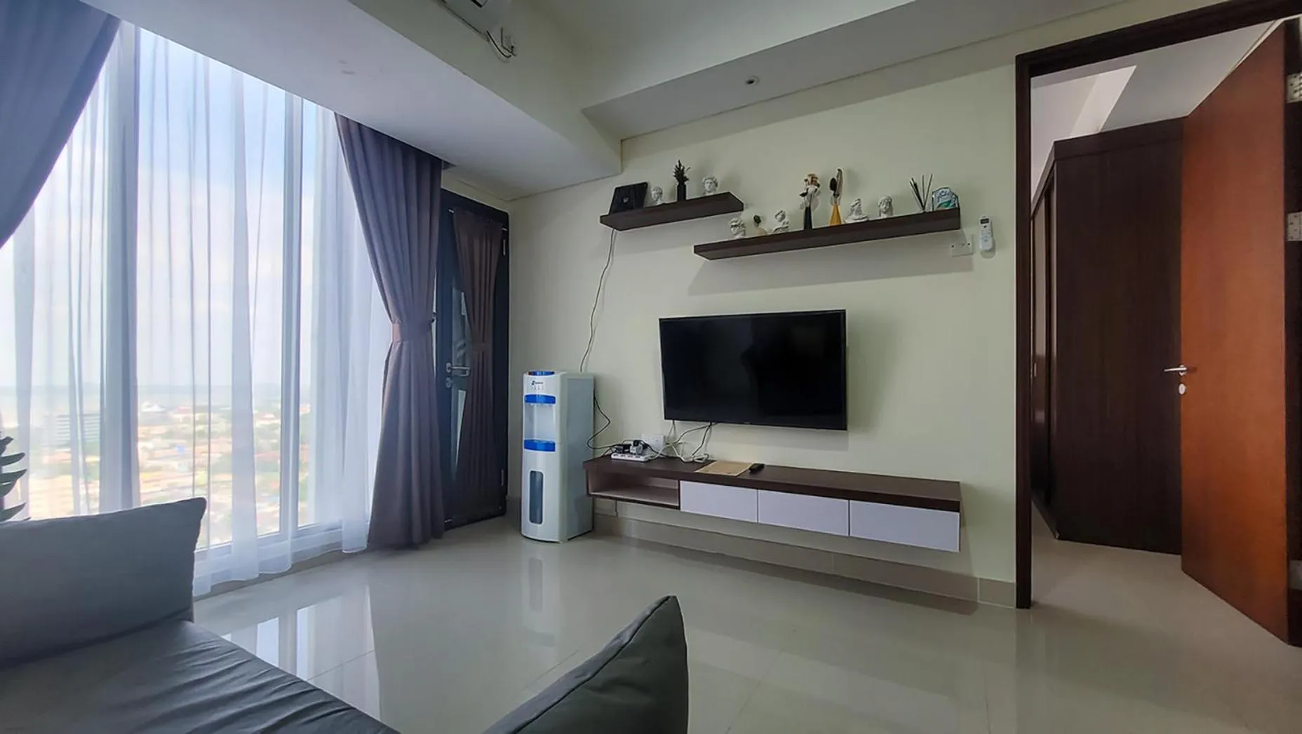 TV and multimedia in Palam Mansion at Meisterstadt Pollux Habibie Apartment