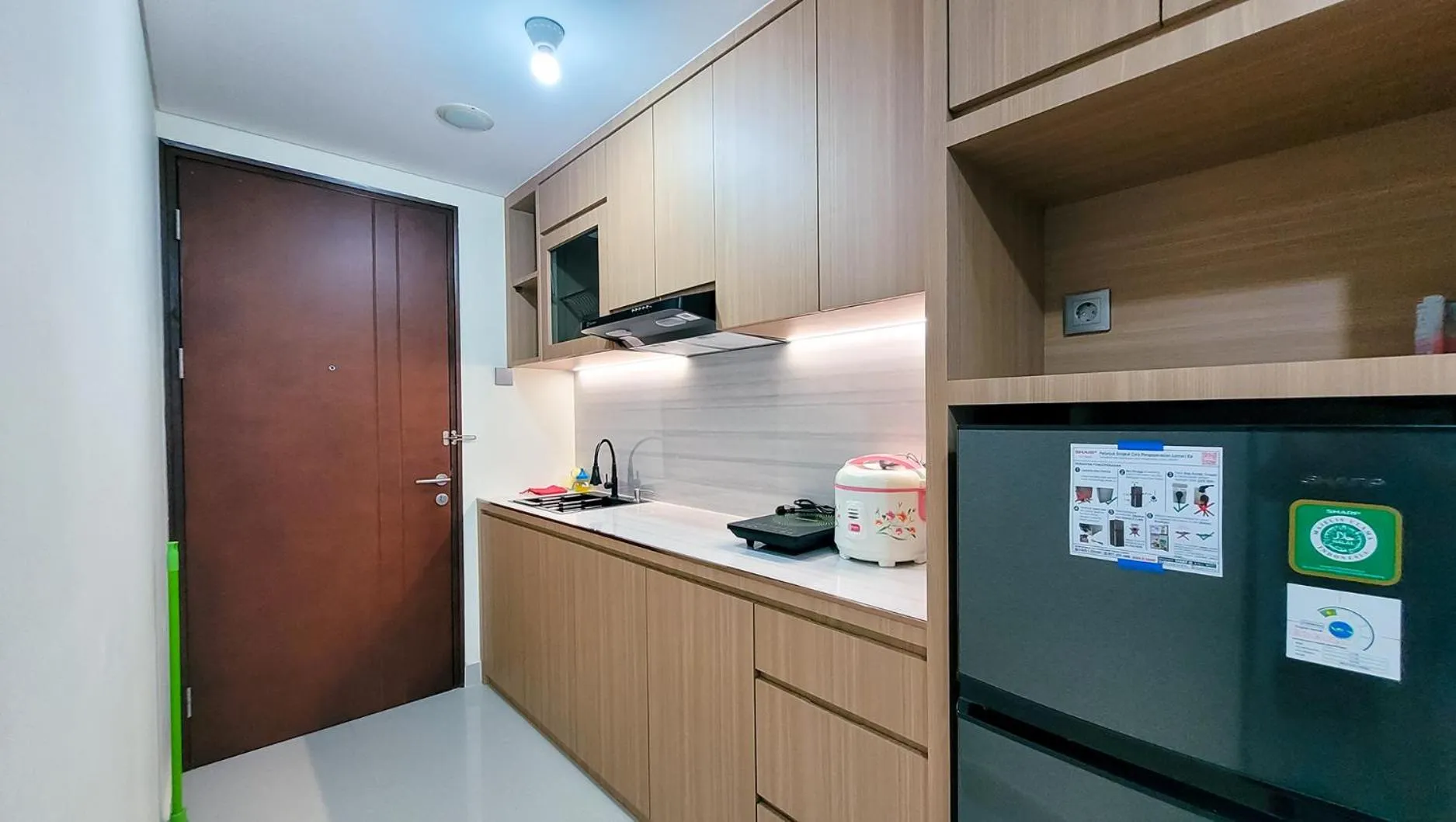 Kitchen or kitchenette in Palam Mansion at Meisterstadt Pollux Habibie Apartment