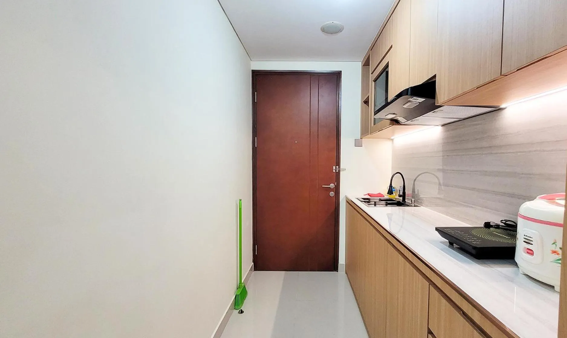 Kitchen or kitchenette in Palam Mansion at Meisterstadt Pollux Habibie Apartment