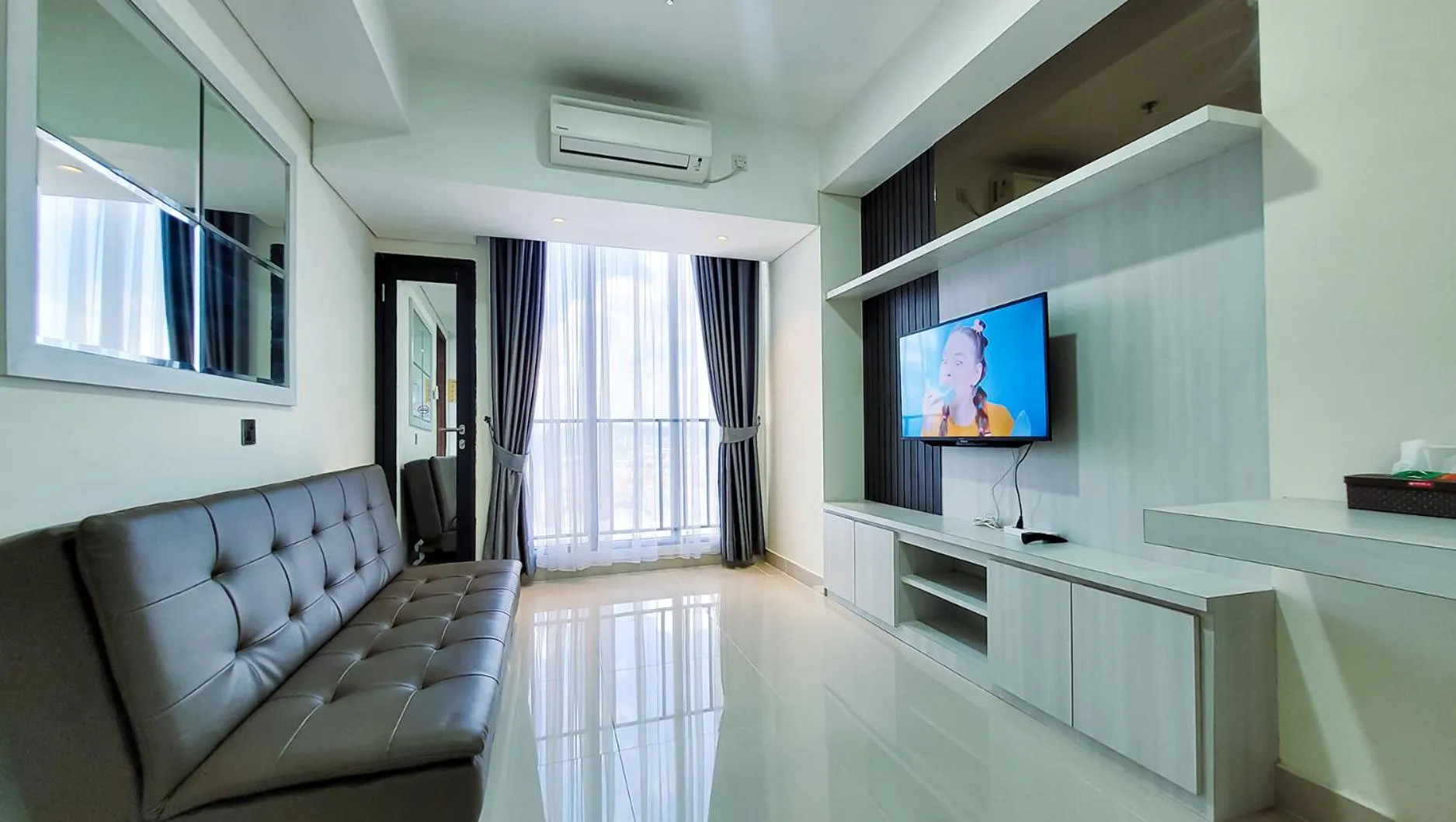 TV and multimedia in Palam Mansion at Meisterstadt Pollux Habibie Apartment