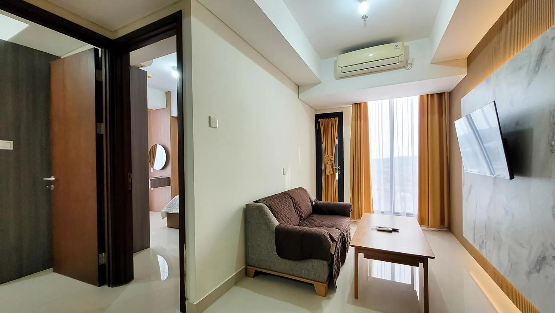 Communal lounge/ TV room in Palam Mansion at Meisterstadt Pollux Habibie Apartment