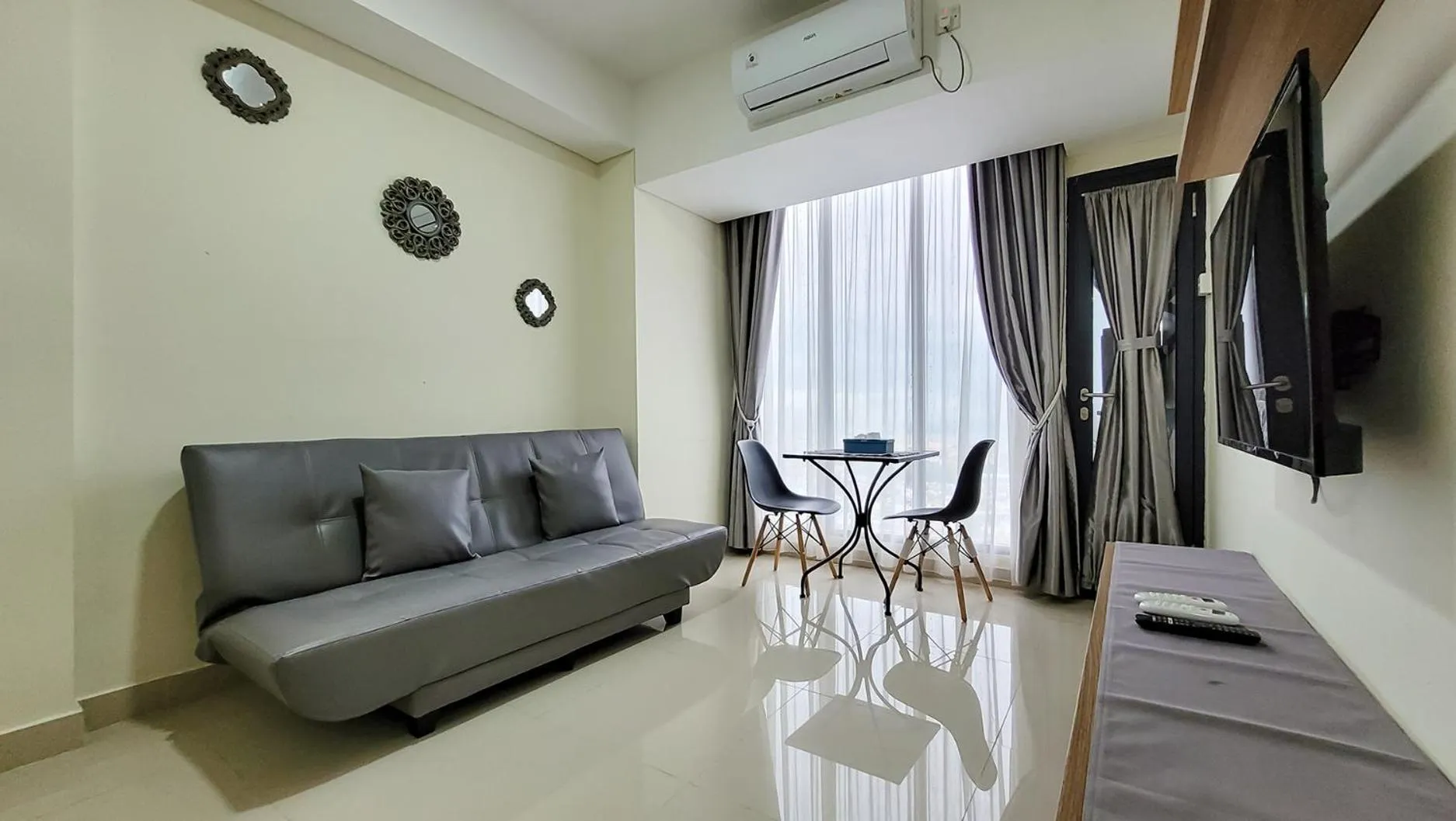 TV and multimedia in Palam Mansion at Meisterstadt Pollux Habibie Apartment