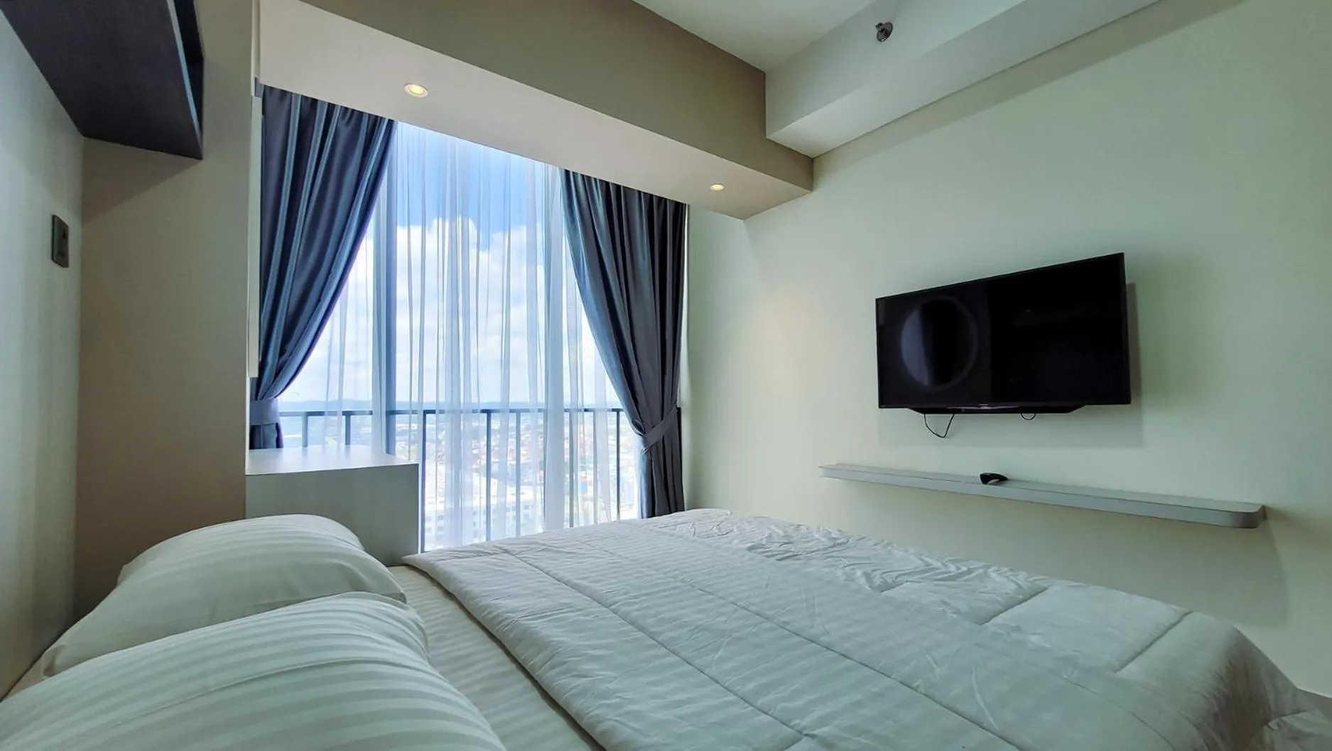 Bed in Palam Mansion at Meisterstadt Pollux Habibie Apartment