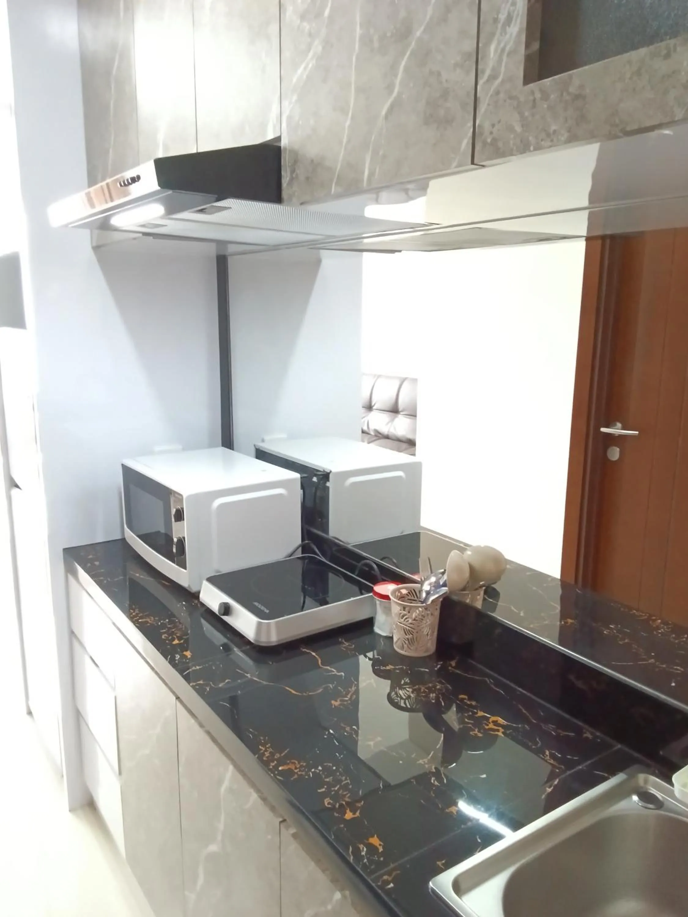 minibar in Palam Mansion at Meisterstadt Pollux Habibie Apartment