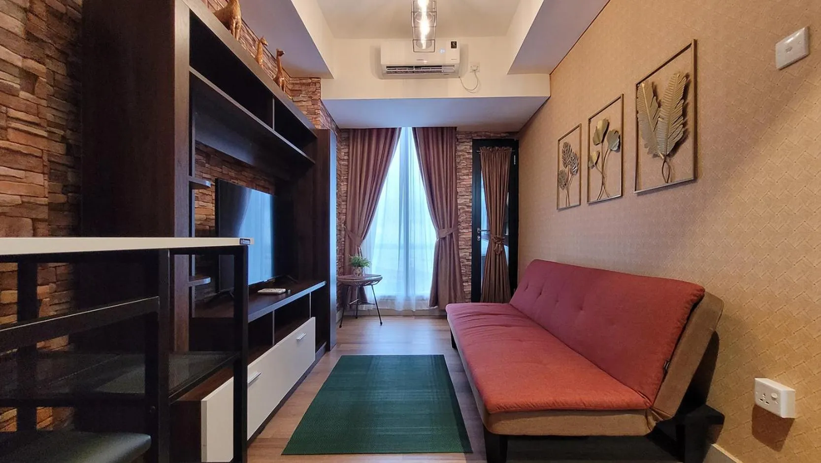 TV and multimedia in Palam Mansion at Meisterstadt Pollux Habibie Apartment