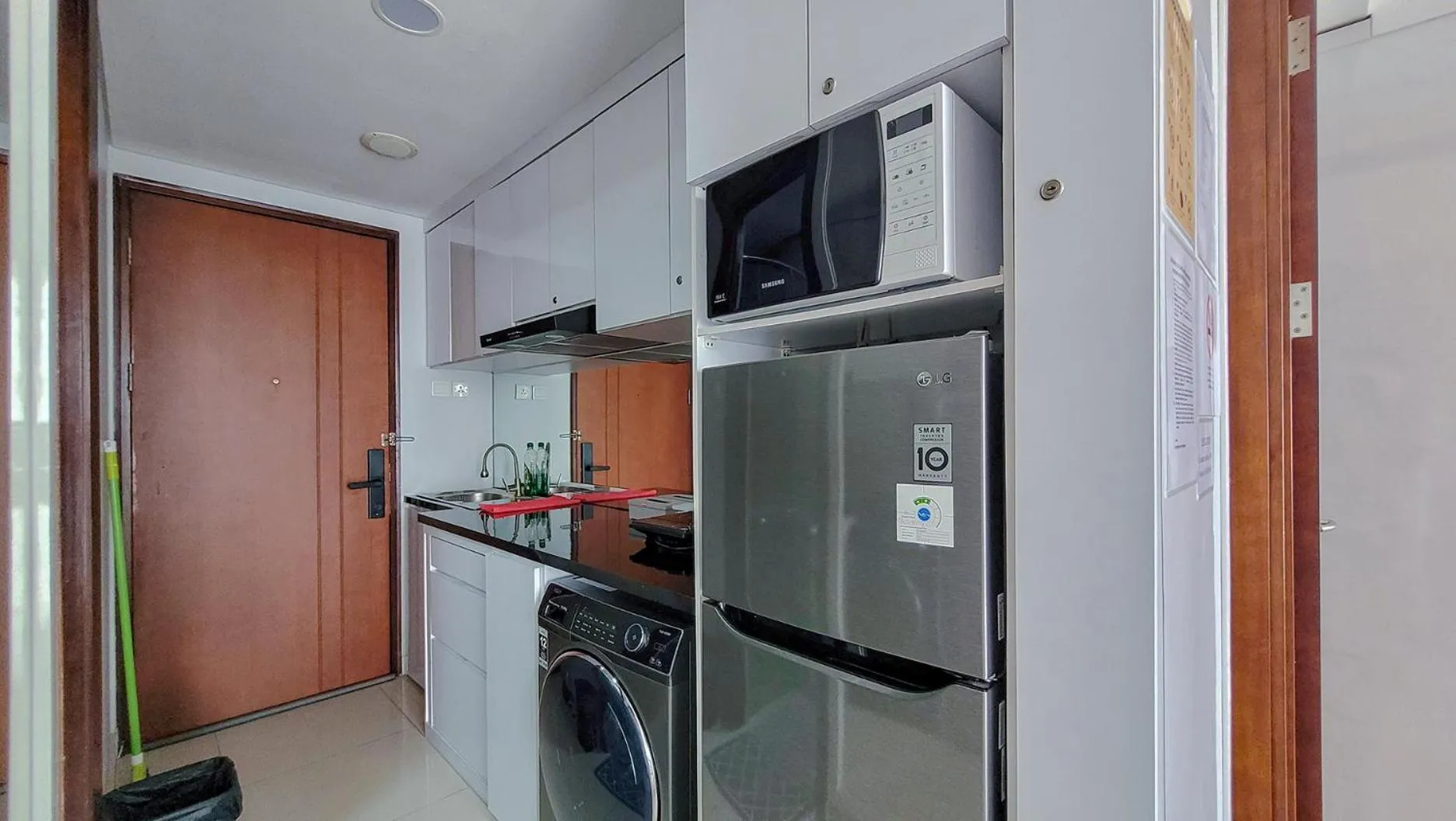Kitchen or kitchenette in Palam Mansion at Meisterstadt Pollux Habibie Apartment