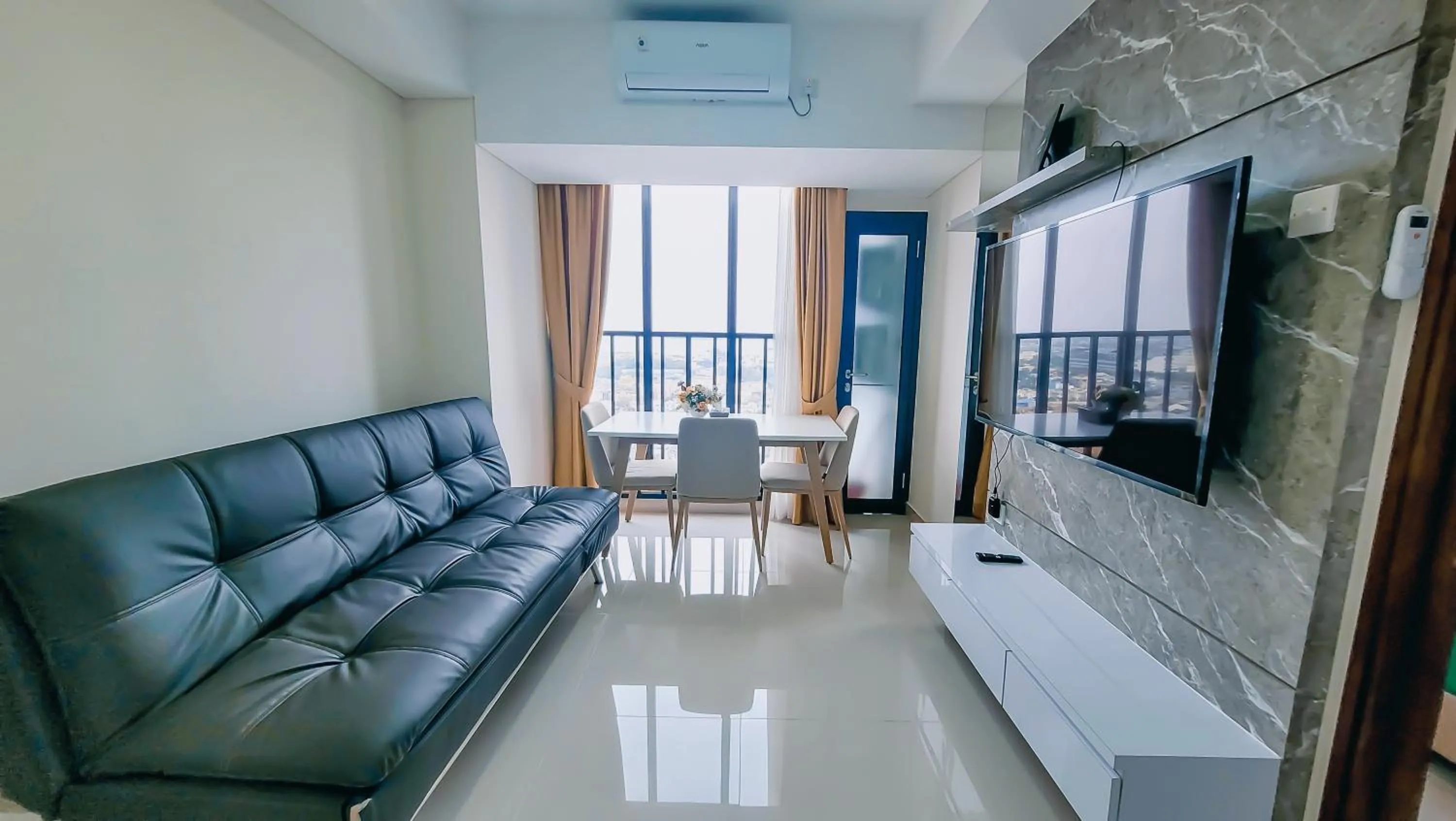 Communal lounge/ TV room in Palam Mansion at Meisterstadt Pollux Habibie Apartment