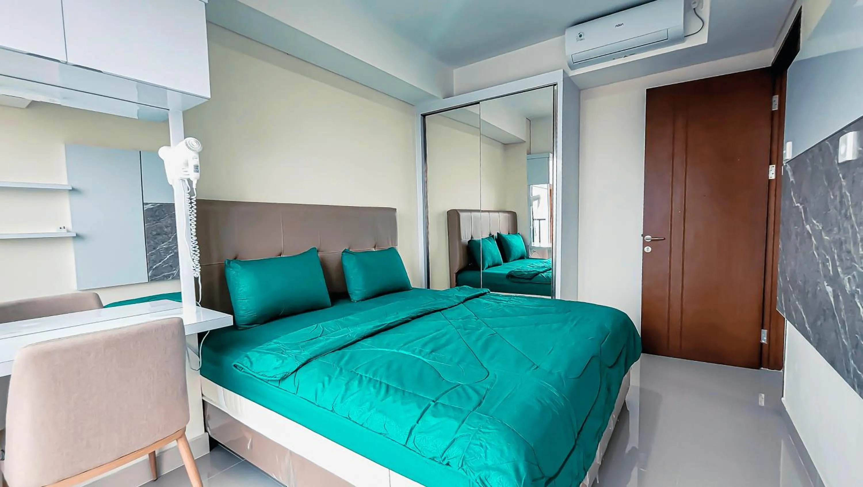 Bed in Palam Mansion at Meisterstadt Pollux Habibie Apartment