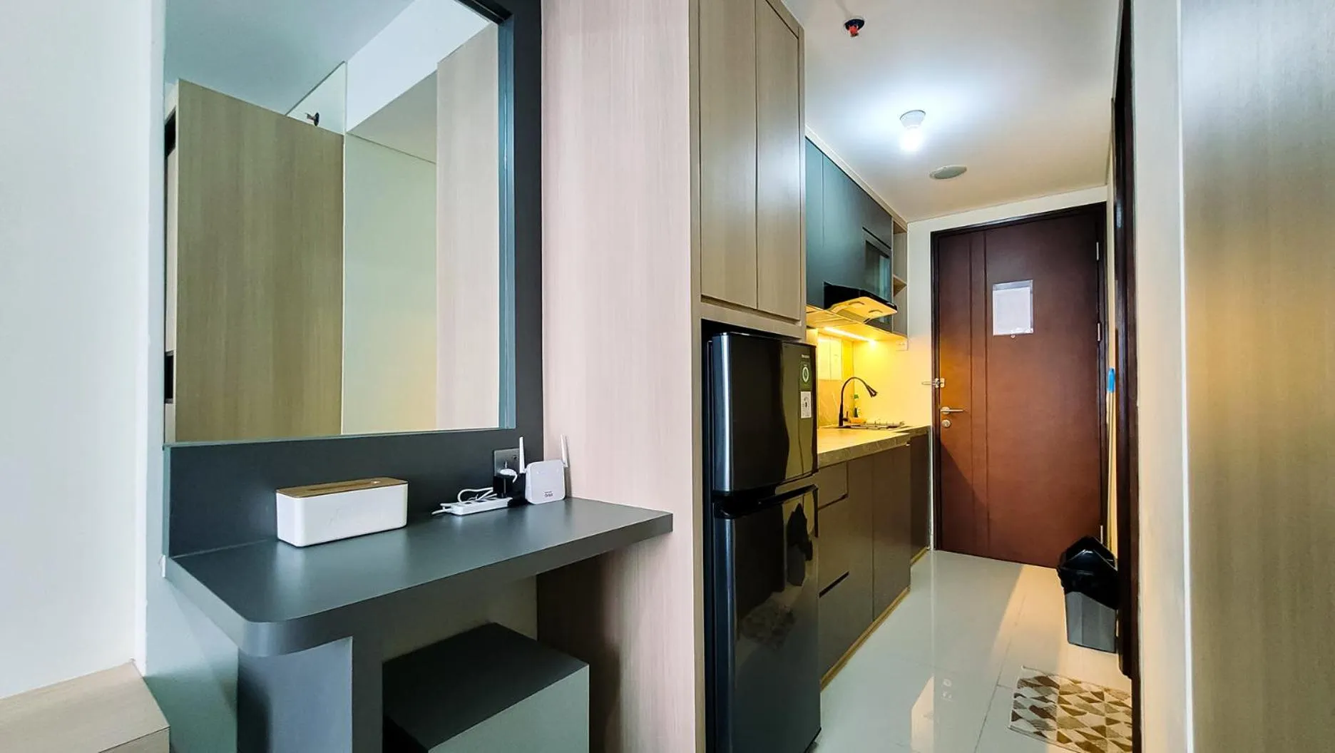 Kitchen or kitchenette in Palam Mansion at Meisterstadt Pollux Habibie Apartment