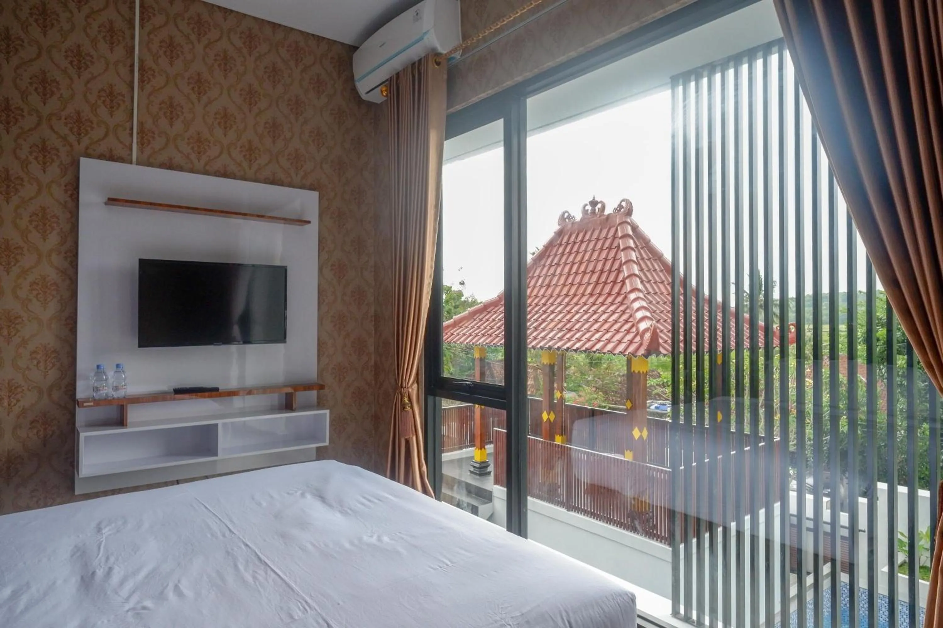 Bedroom, Bed in The Lavana Greenkhaza Villa Jogja