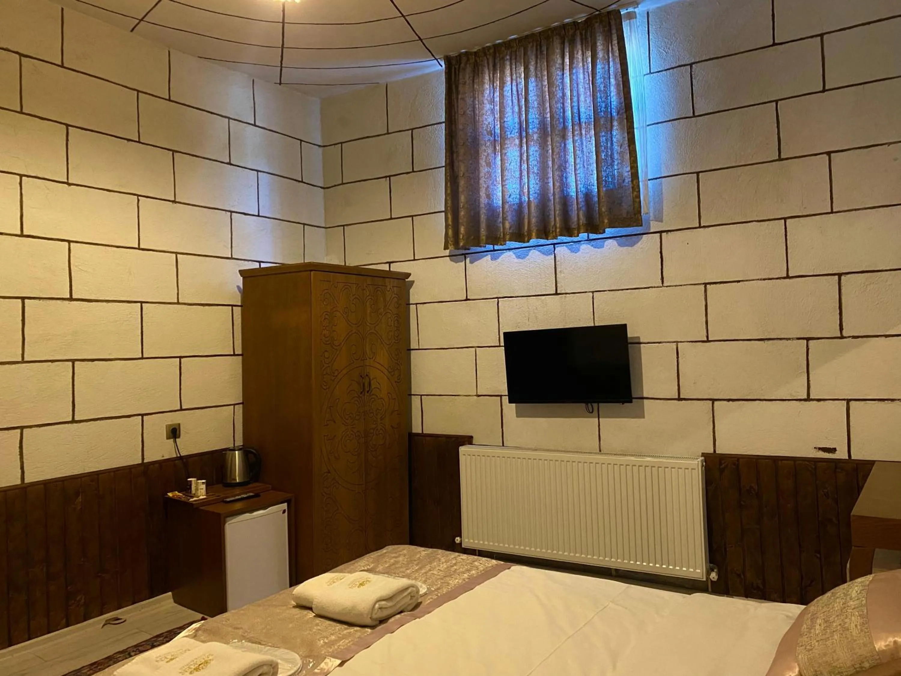 Bed in Mesken Cave Suites