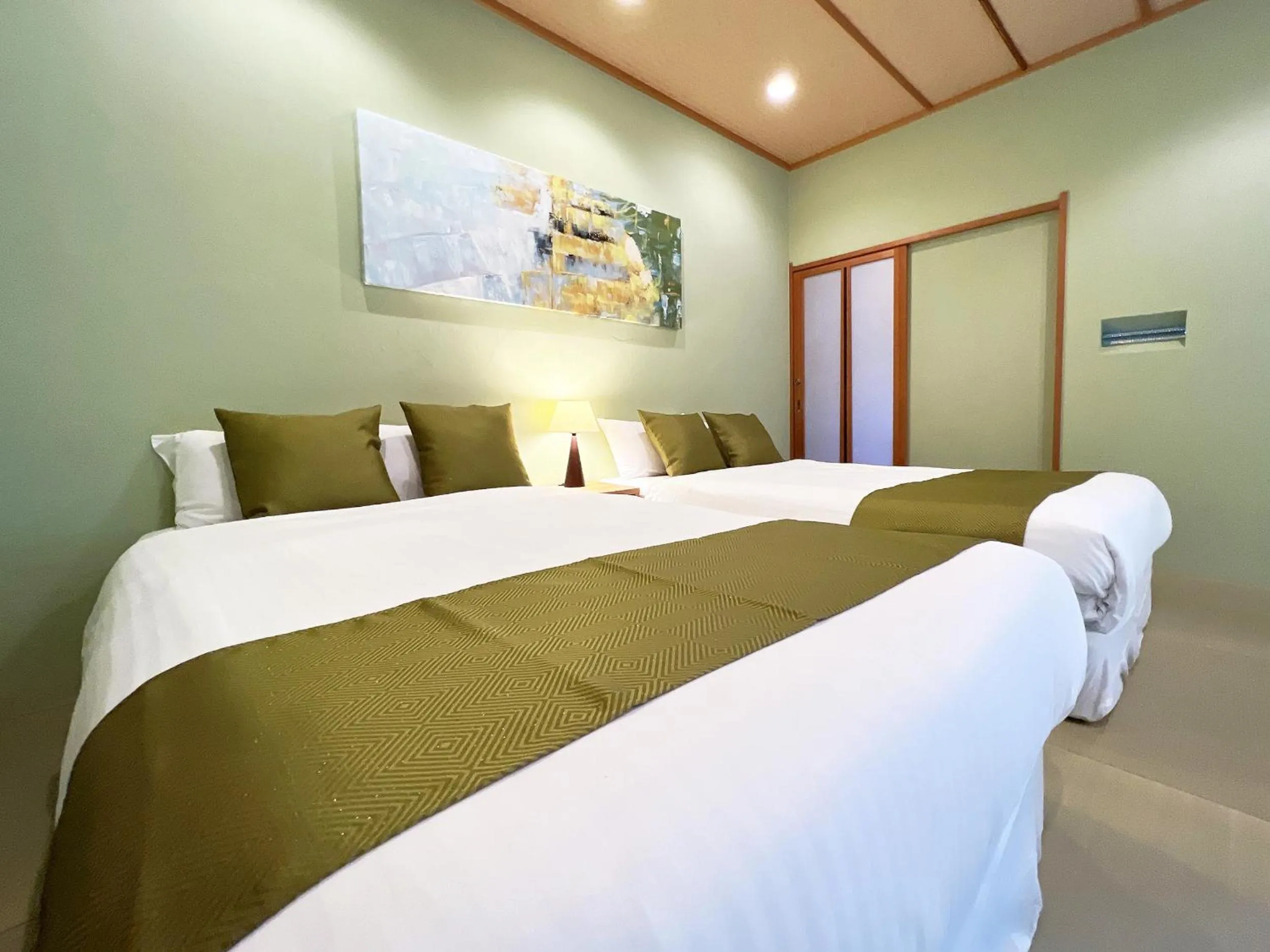 Bed in OWL RESORT ARIFUKU ONSEN