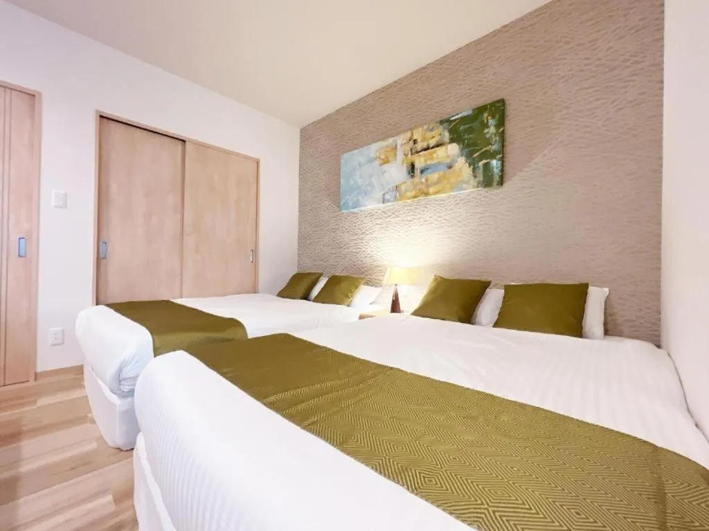 Bed in OWL RESORT ARIFUKU ONSEN