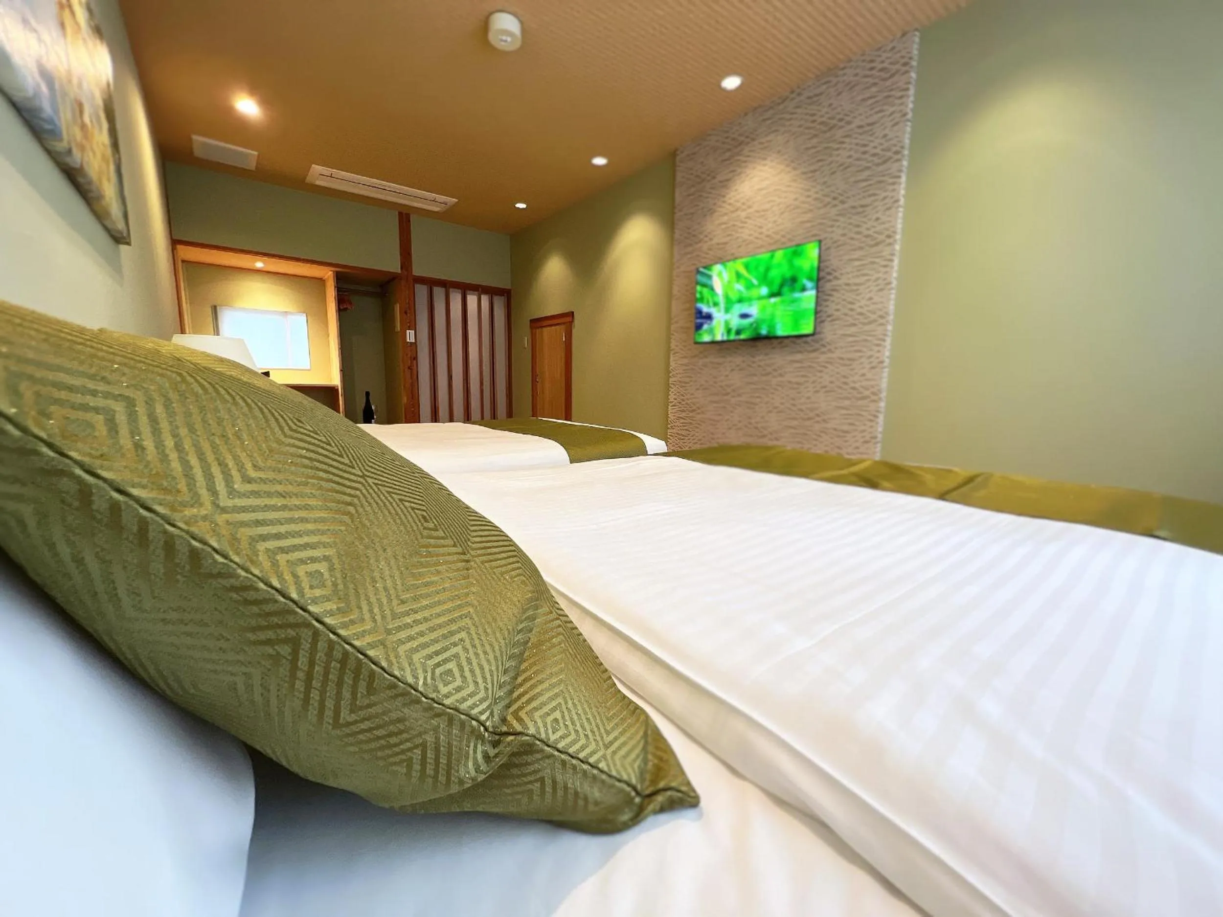 Bed in OWL RESORT ARIFUKU ONSEN