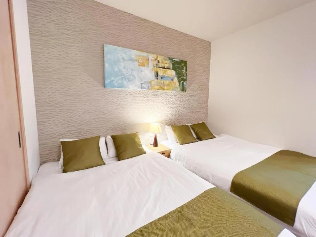 Bed in OWL RESORT ARIFUKU ONSEN