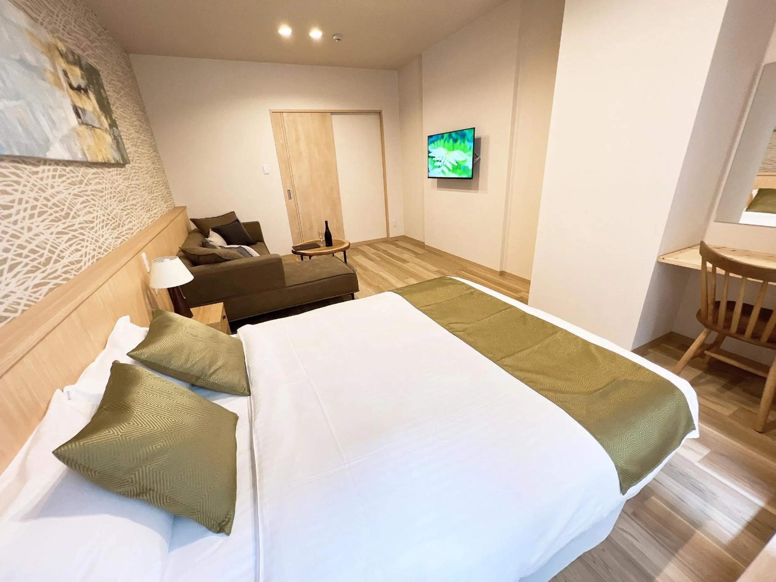 Bed in OWL RESORT ARIFUKU ONSEN