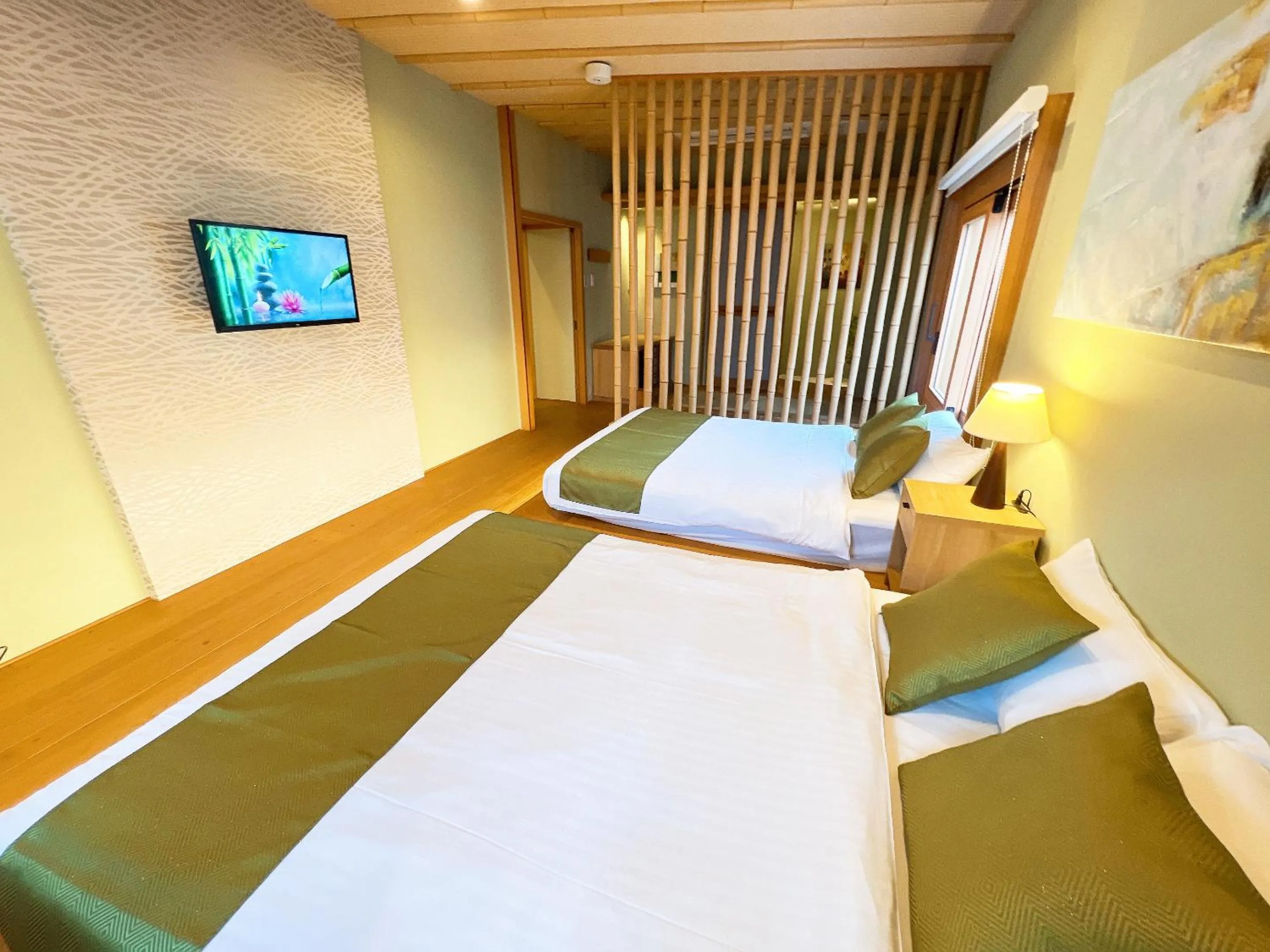 Bed in OWL RESORT ARIFUKU ONSEN