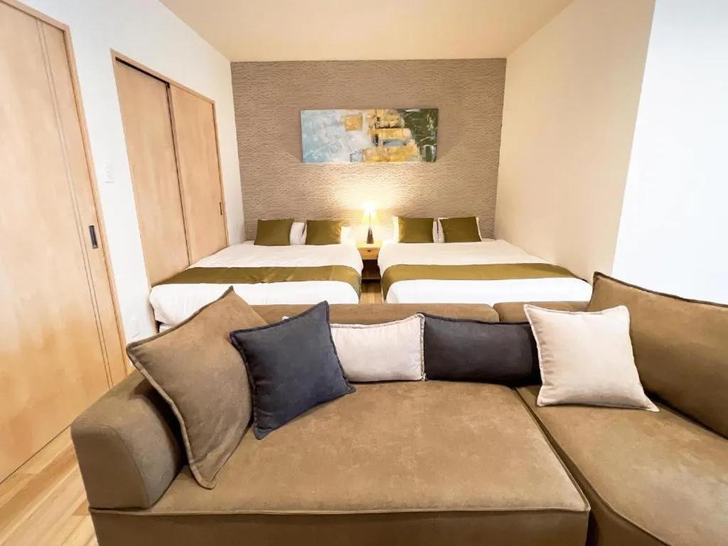 Bed in OWL RESORT ARIFUKU ONSEN