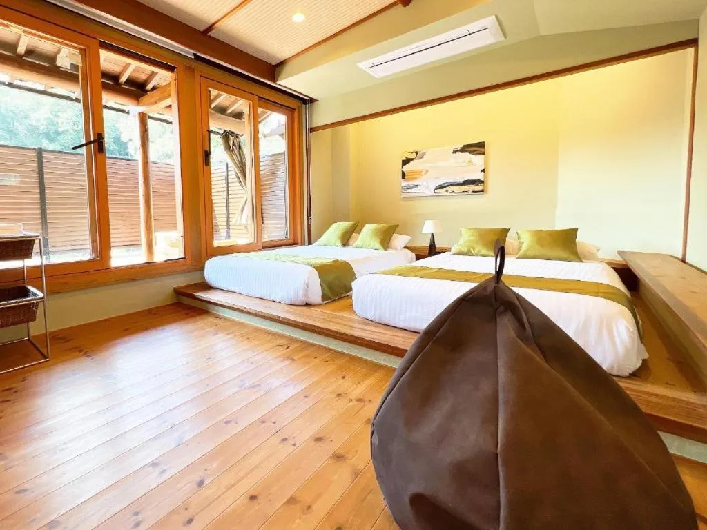 Bed in OWL RESORT ARIFUKU ONSEN