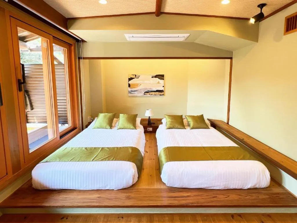 Bed in OWL RESORT ARIFUKU ONSEN