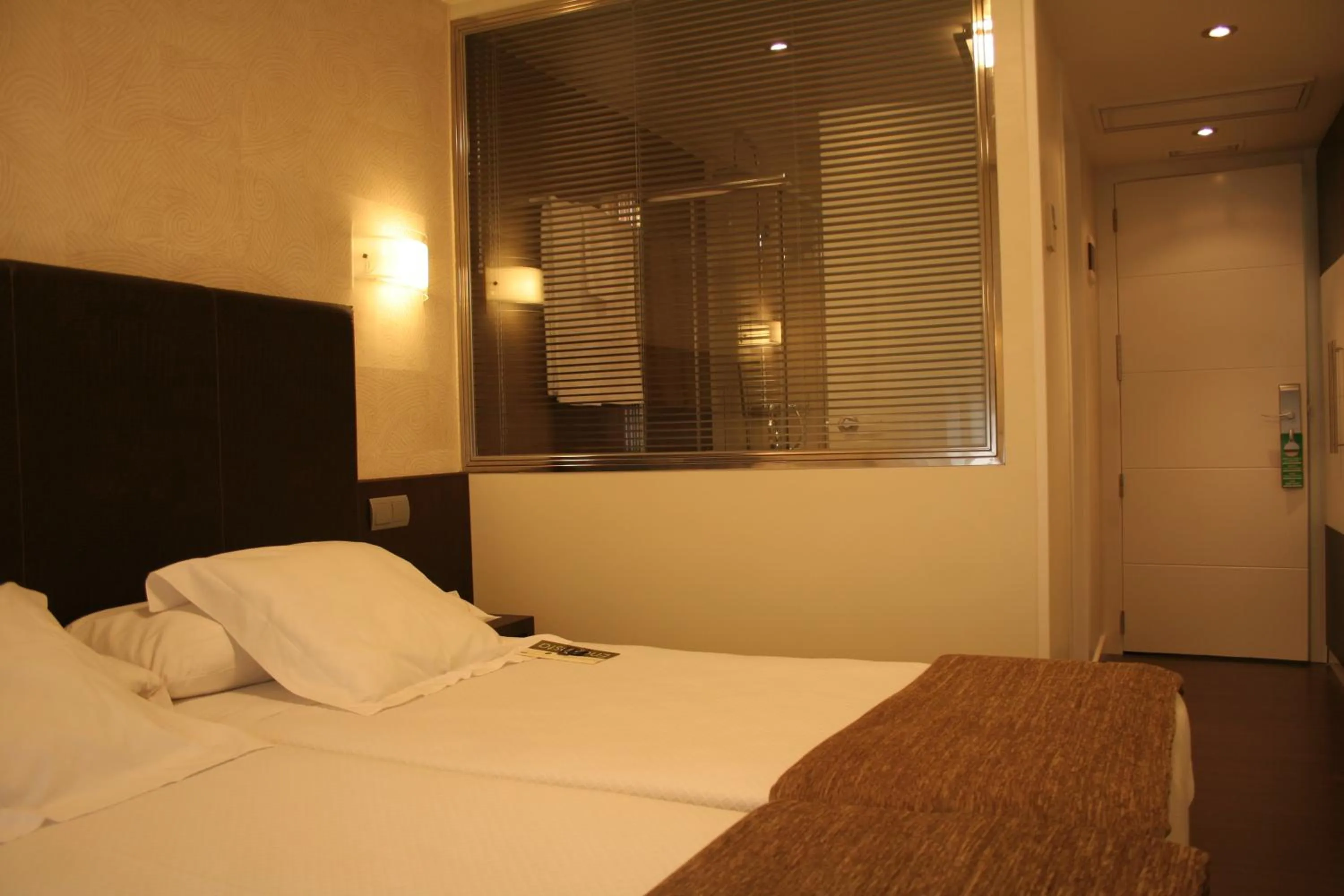 Bed in Hotel Alda San Carlos