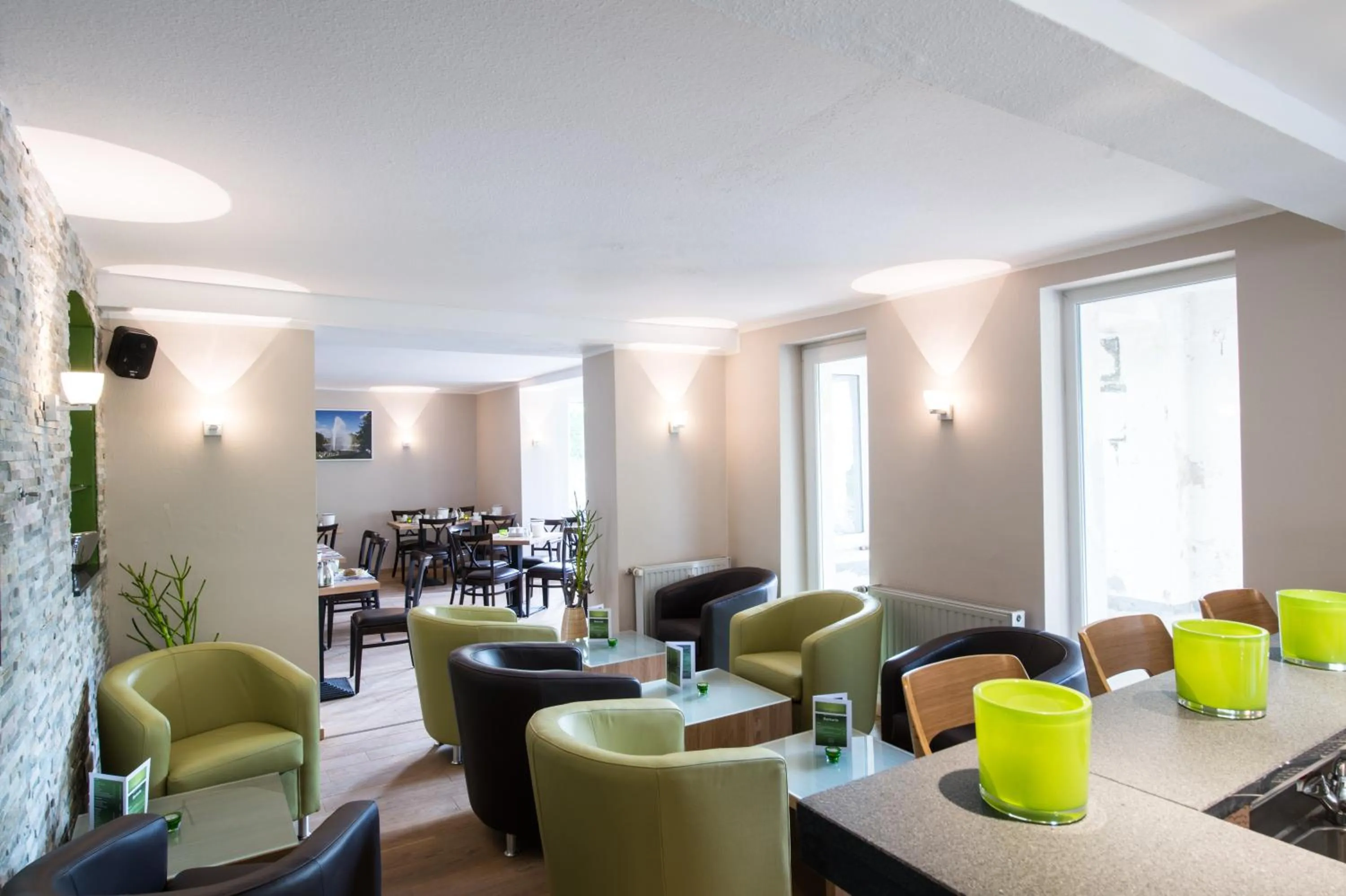 Communal lounge/ TV room in Hotel am Herkules