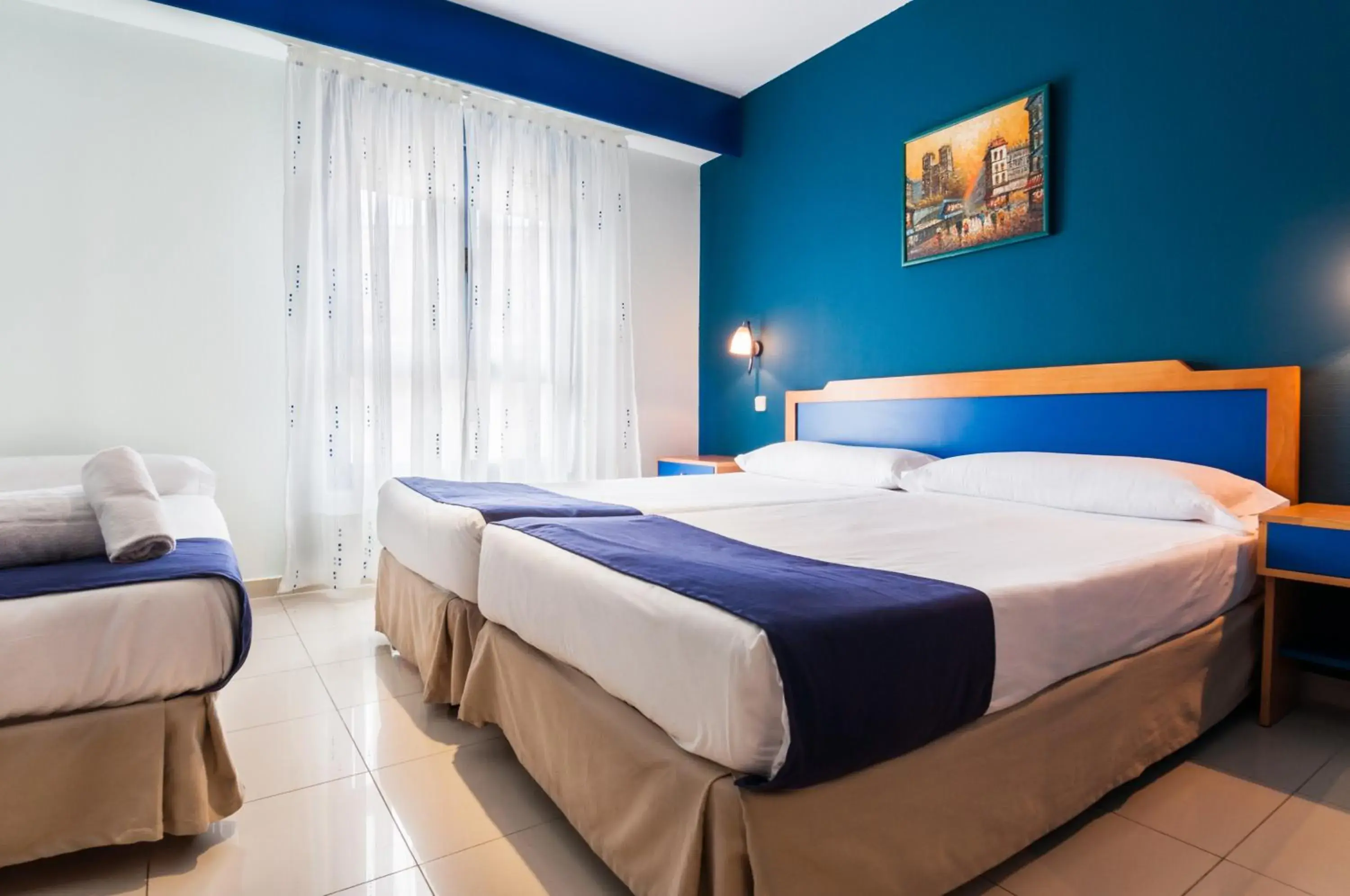 Twin Room with Extra Bed (2 Adults + 2 Children) in Hotel Villa De Pinto Twin Room with Extra Bed (2 Adults + 2 Children) in Hotel Villa De Pinto