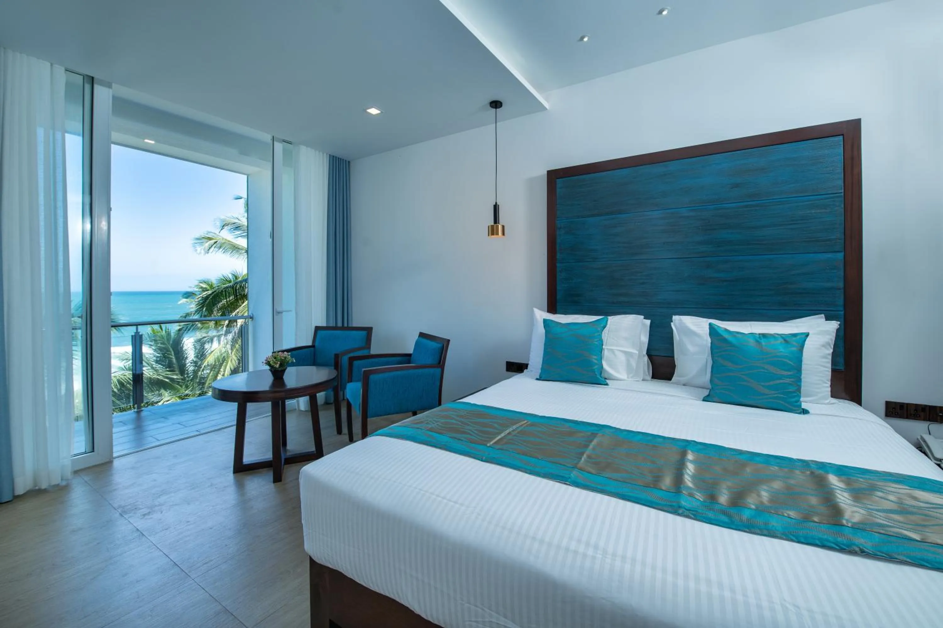 Bed in Grand Samudra Hotel